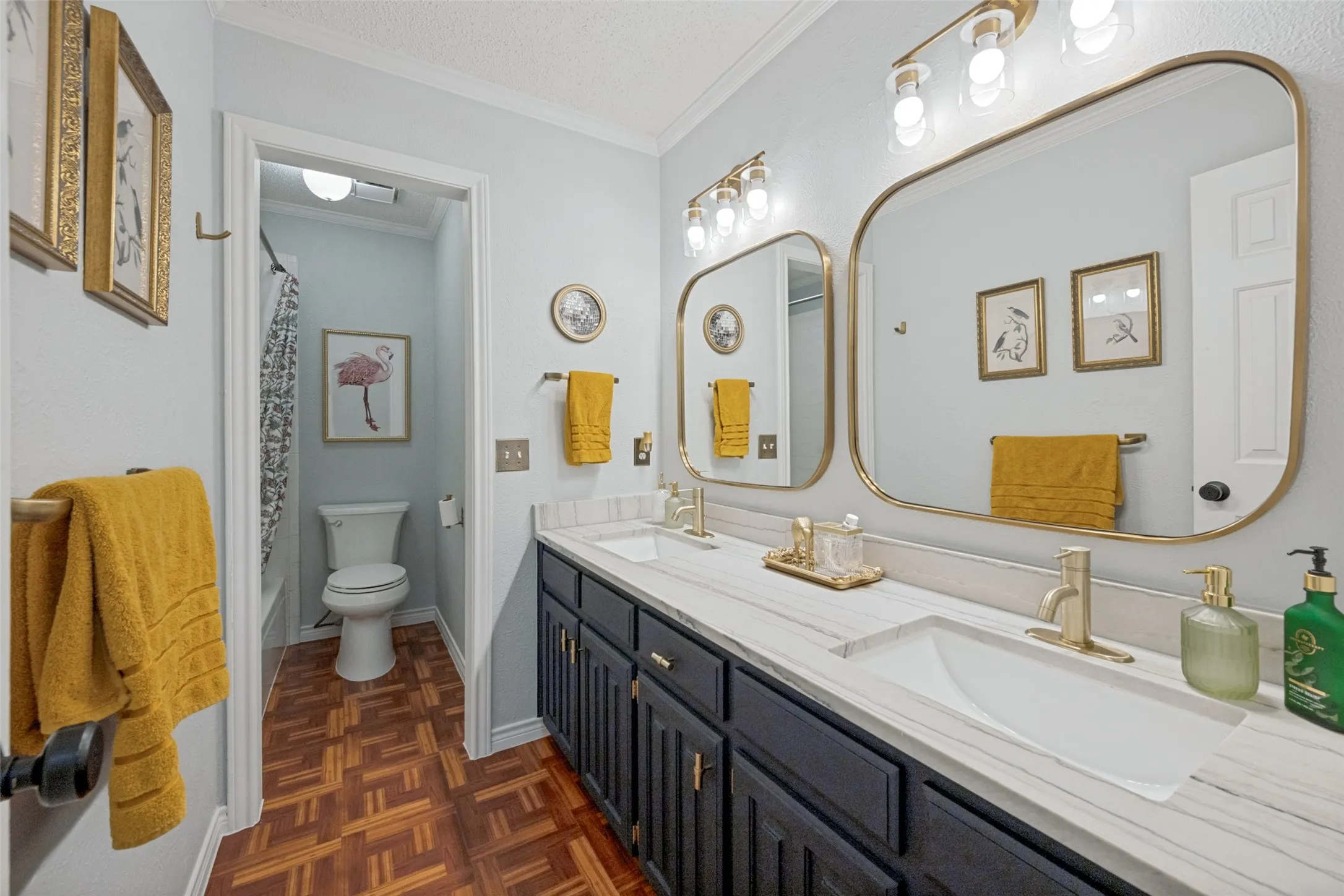 Secondary Bath with gorgeous recent plumbing fixtures, marble double sinks.