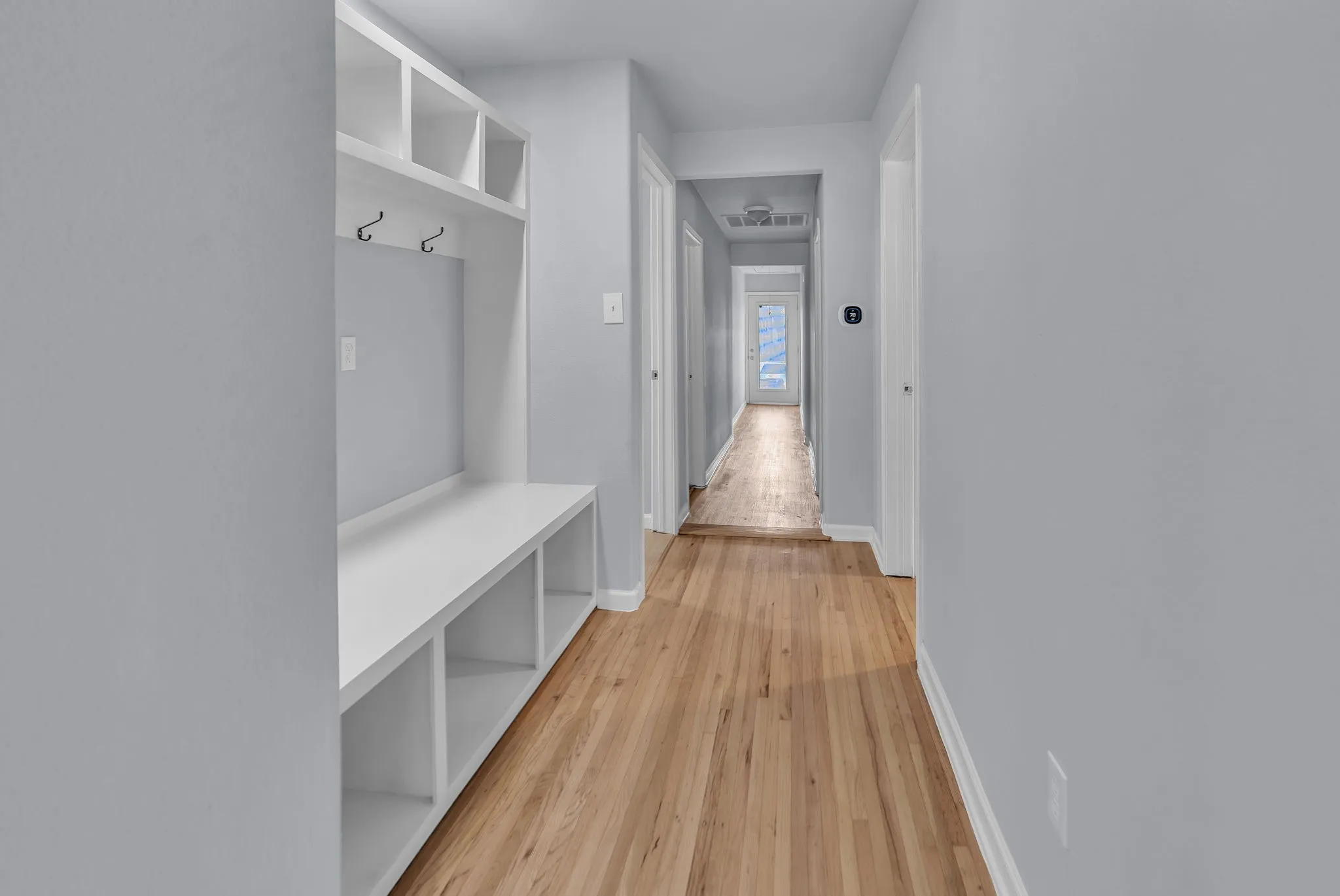 Mudroom and hallway leading to 4 bedrooms