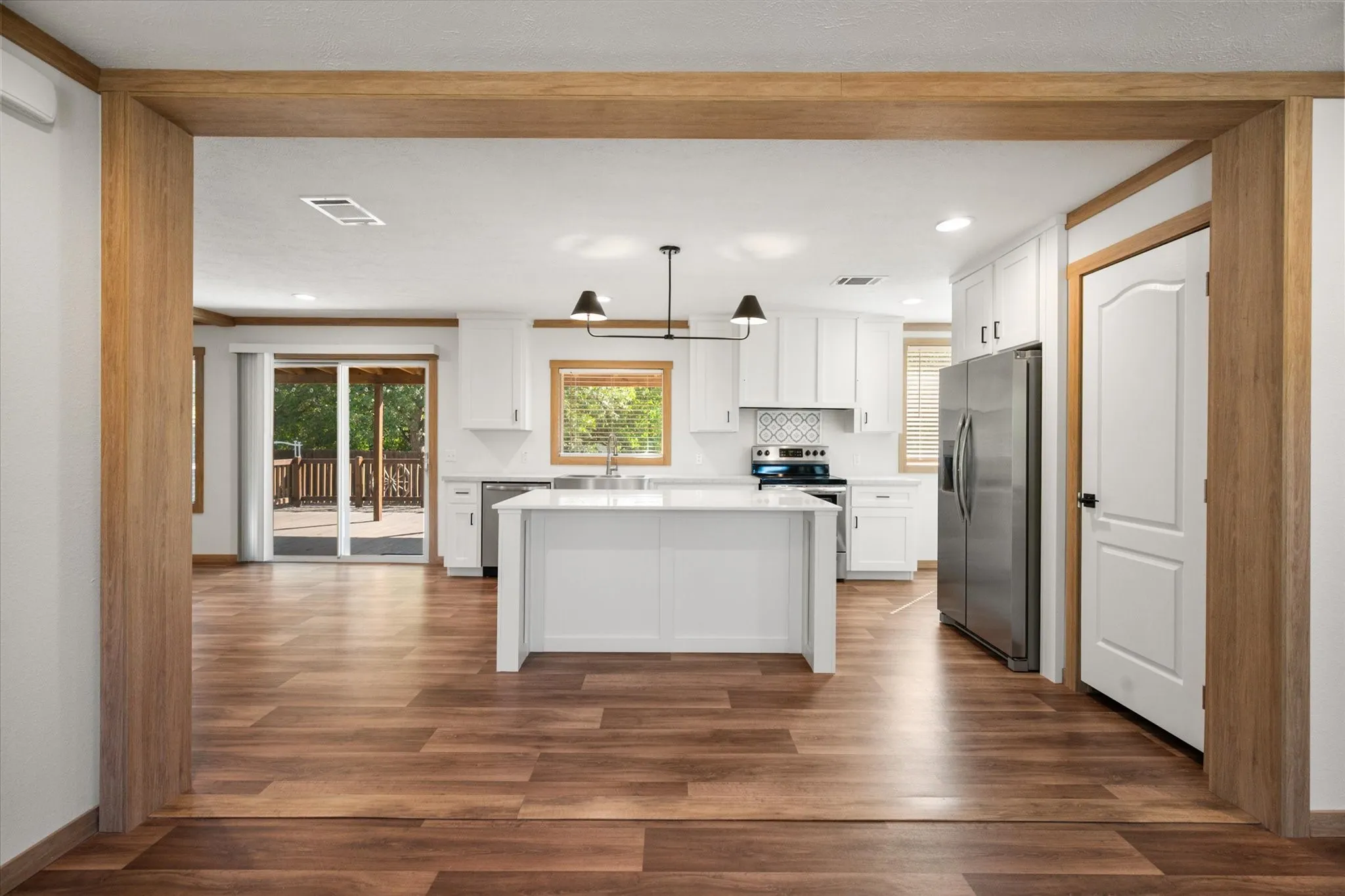 Through the kitchen the kitchen, you will find an expansive open dining area connecting seamlessly with the kitchen and outdoor deck for comfortable everyday living and entertaining.