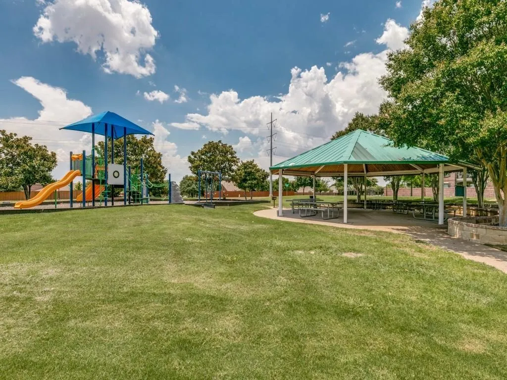 View of home's community with a gazebo and a yard