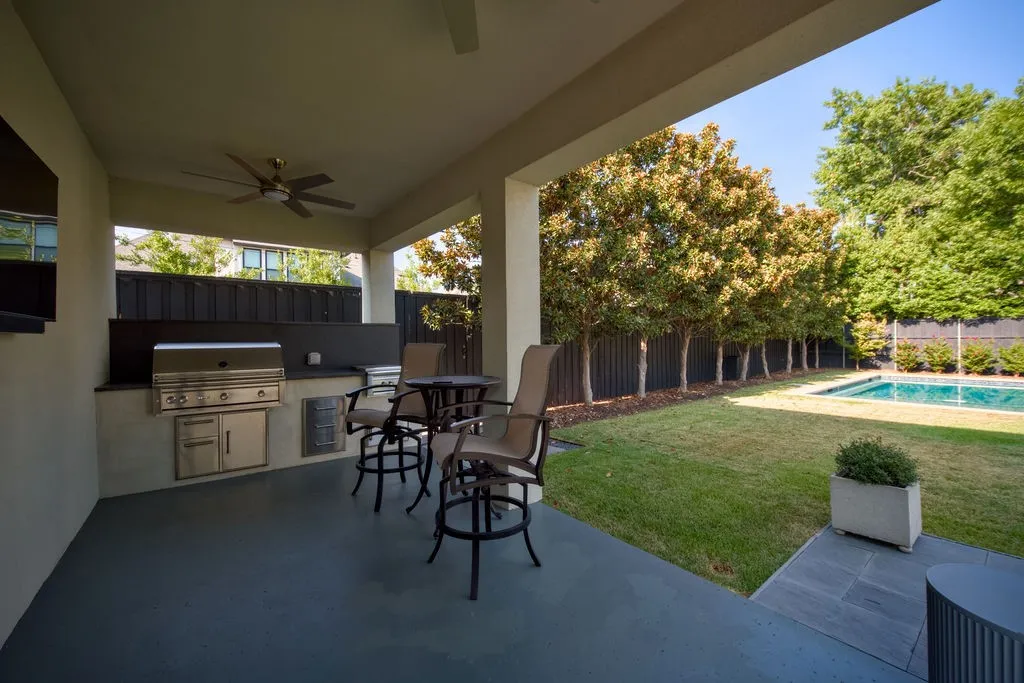 The outdoor kitchen makes summer barbecues and poolside dinners simple