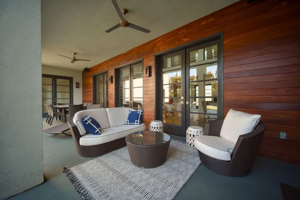 This deep covered back patio creates a comfortable outdoor setting perfect for lounging or alfresco dining