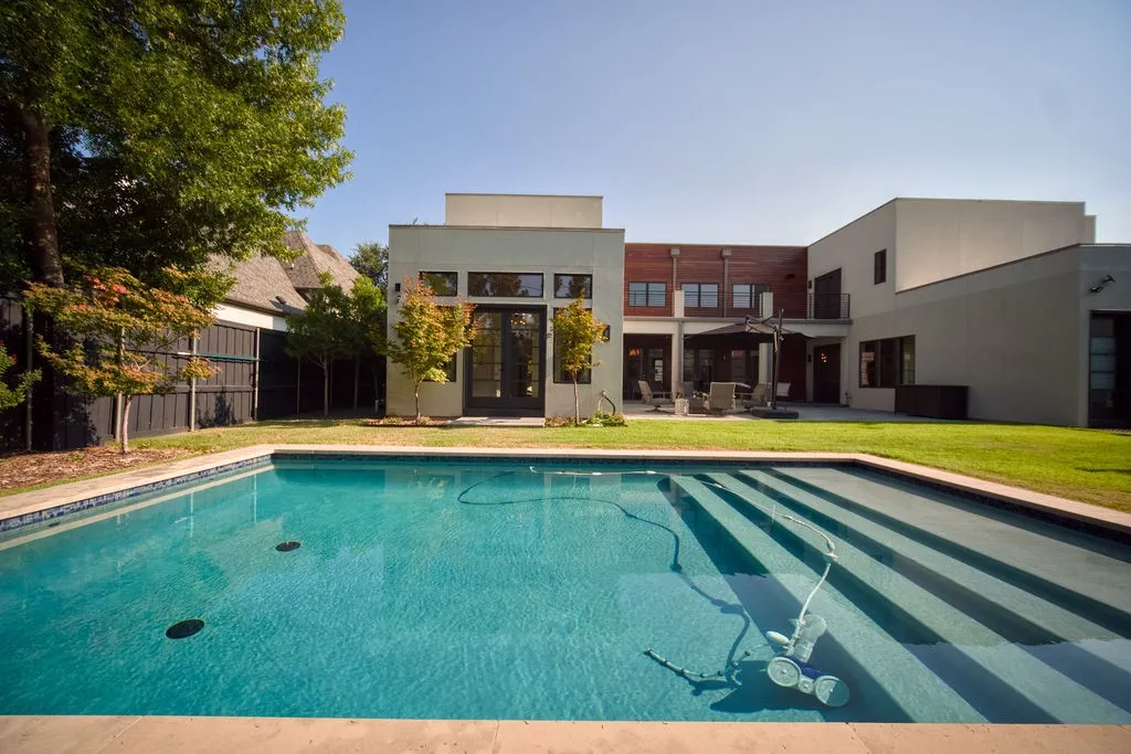 The heated saltwater pool and integrated spa provide a cooling escape during Texas summers