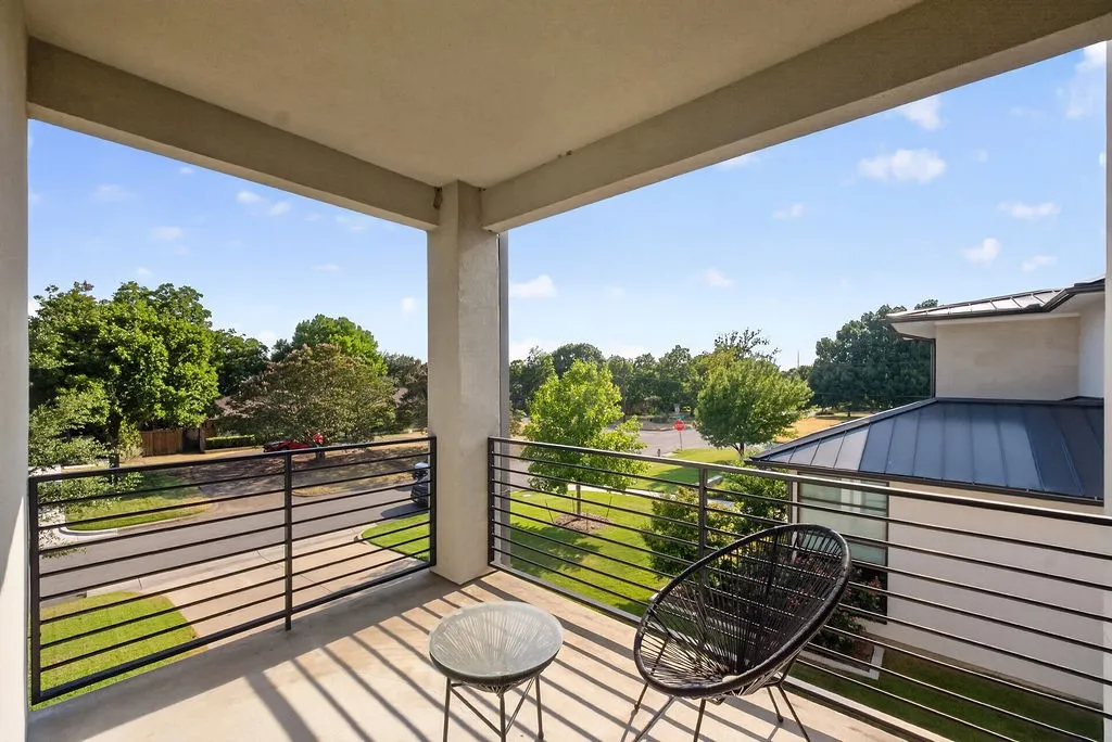 Elevated on the second floor, this private outdoor balcony offers a quiet retreat to step outside for fresh air, enjoy a quiet morning coffee, or take a peaceful break during the day