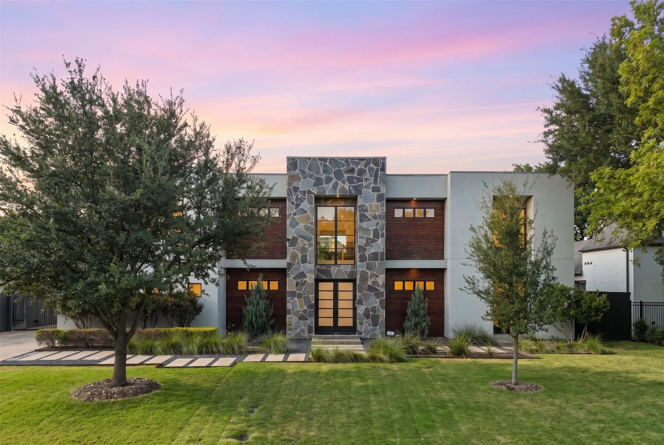 Modern architectural details set a refined tone the moment you step up to the front entrance