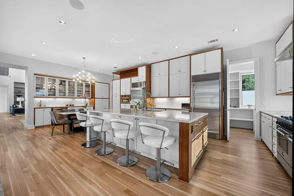 High-end Italian appliances and a massive central island turn daily meal prep into an enjoyable routine