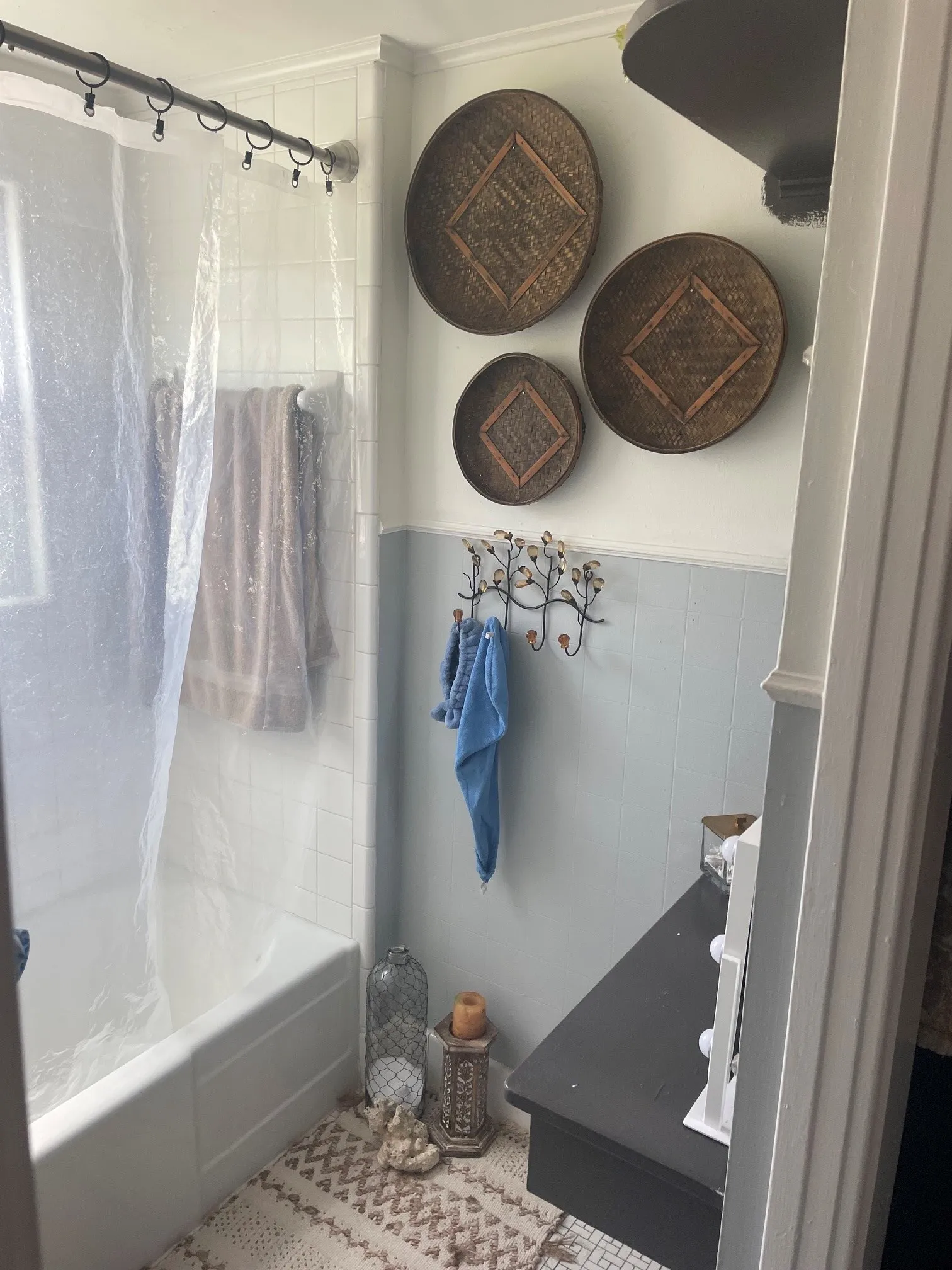 White tiled bathtub with a shower rod