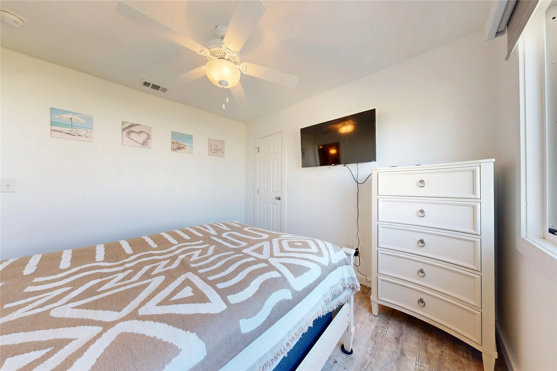 White walls with wood-finish flooring