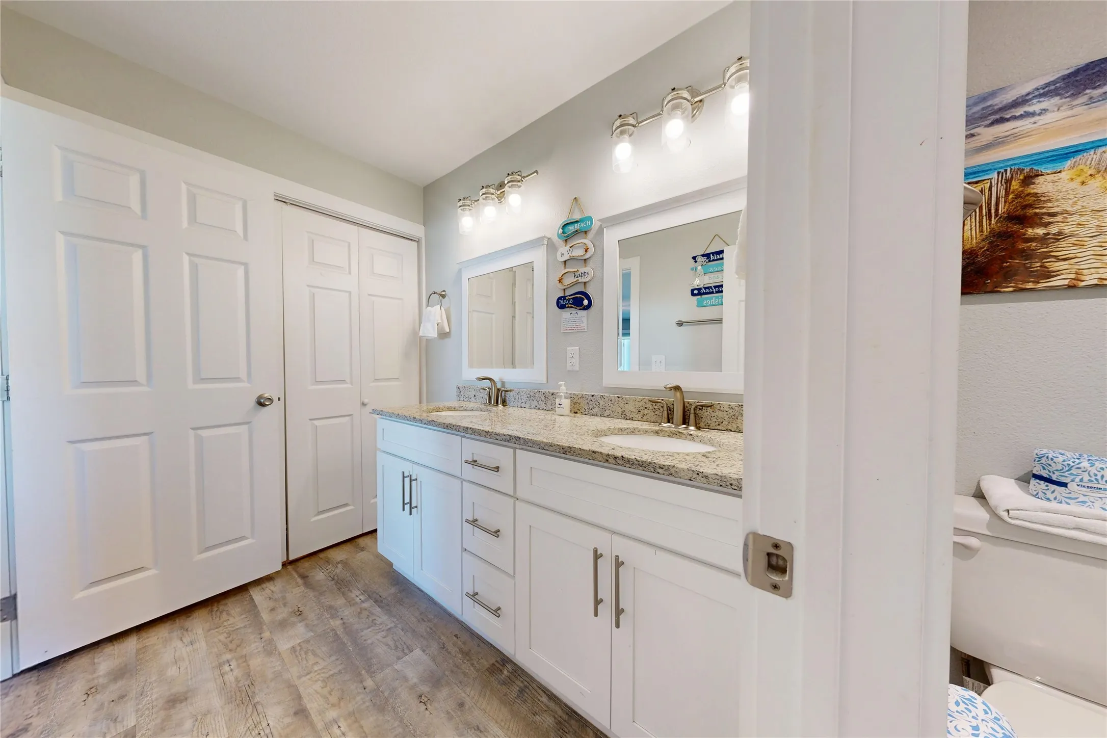 Dual vanity with granite-style countertop and undermount sinks