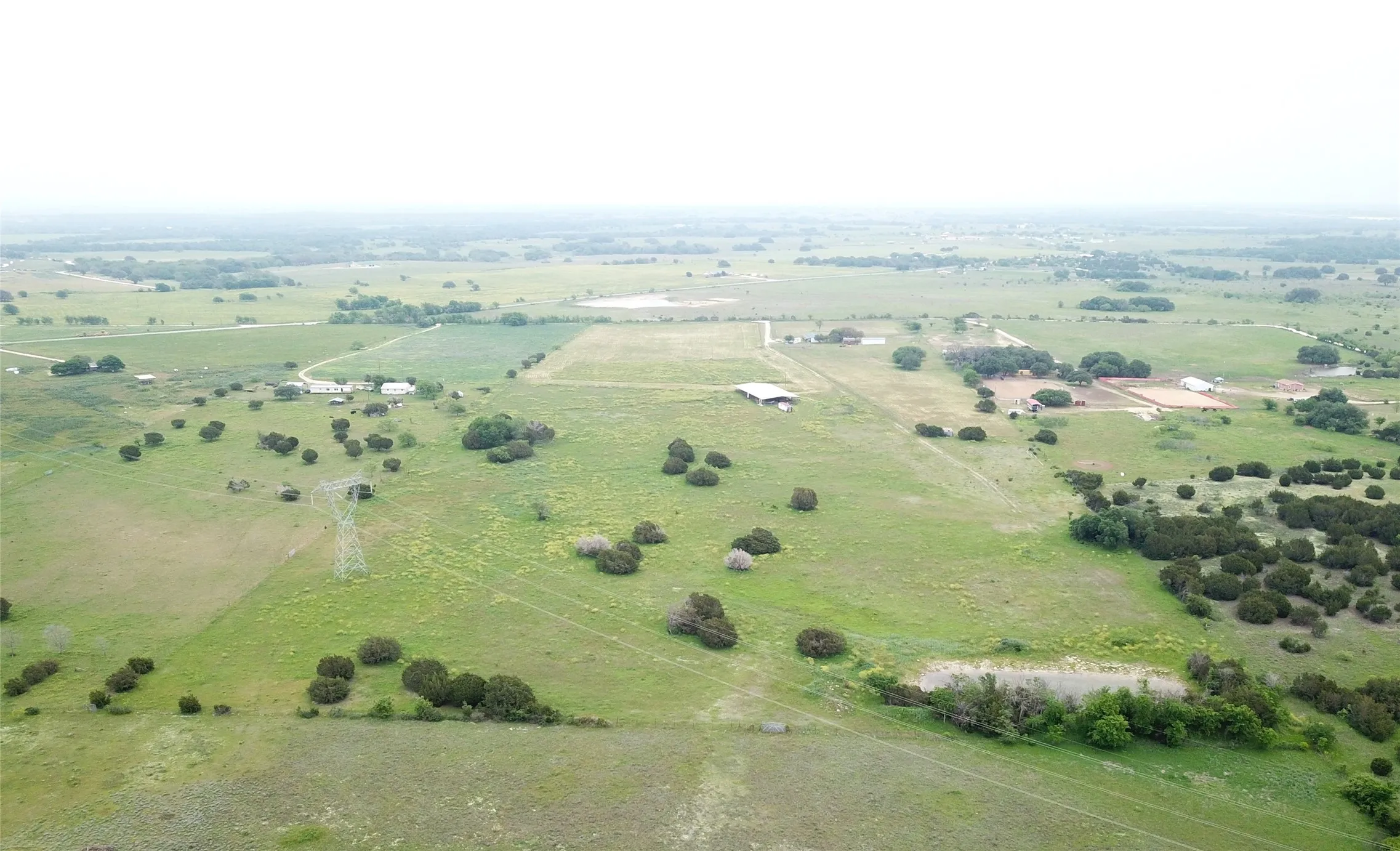 Birds eye view of property with a rural view