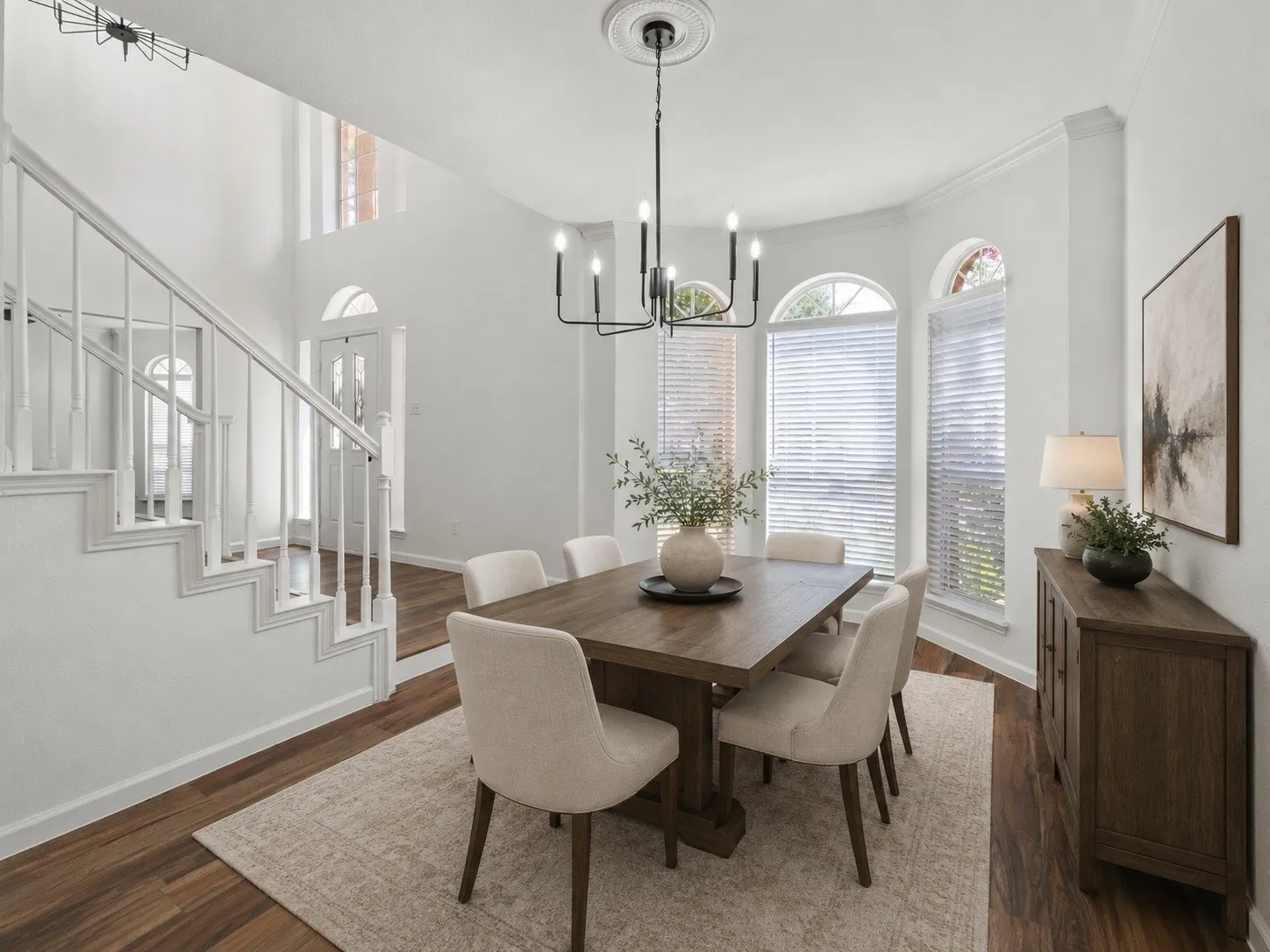 Virtually staged dining area with a warm, welcoming setting.