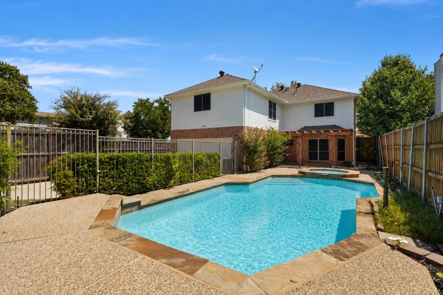 Inviting pool area with a spacious setting, perfect for relaxing or enjoying time outdoors.