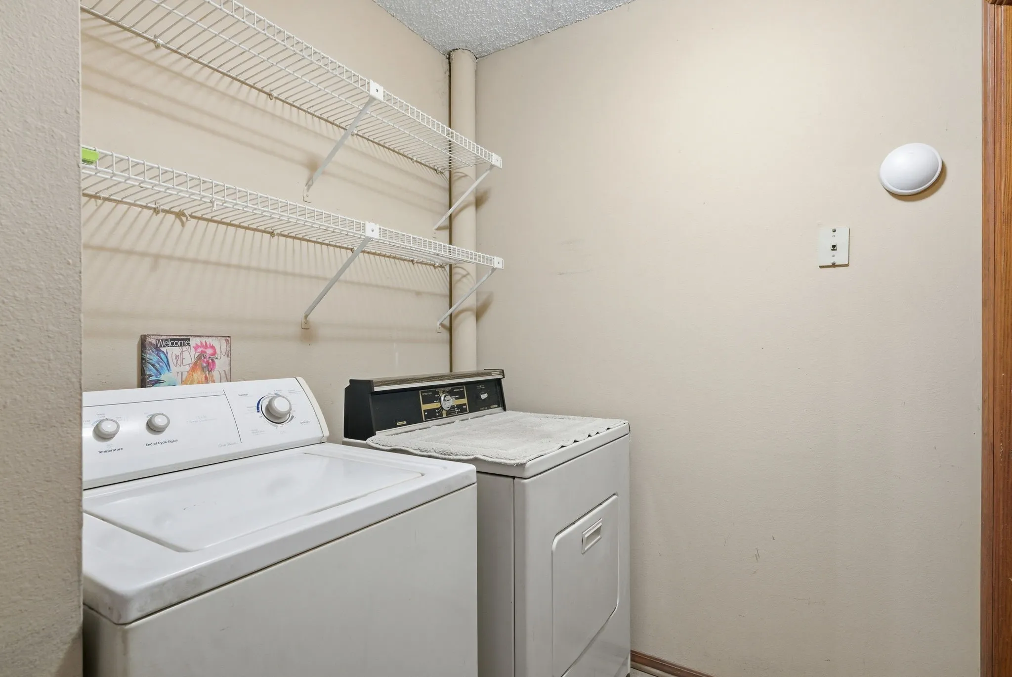 White wire shelving system installed above appliances