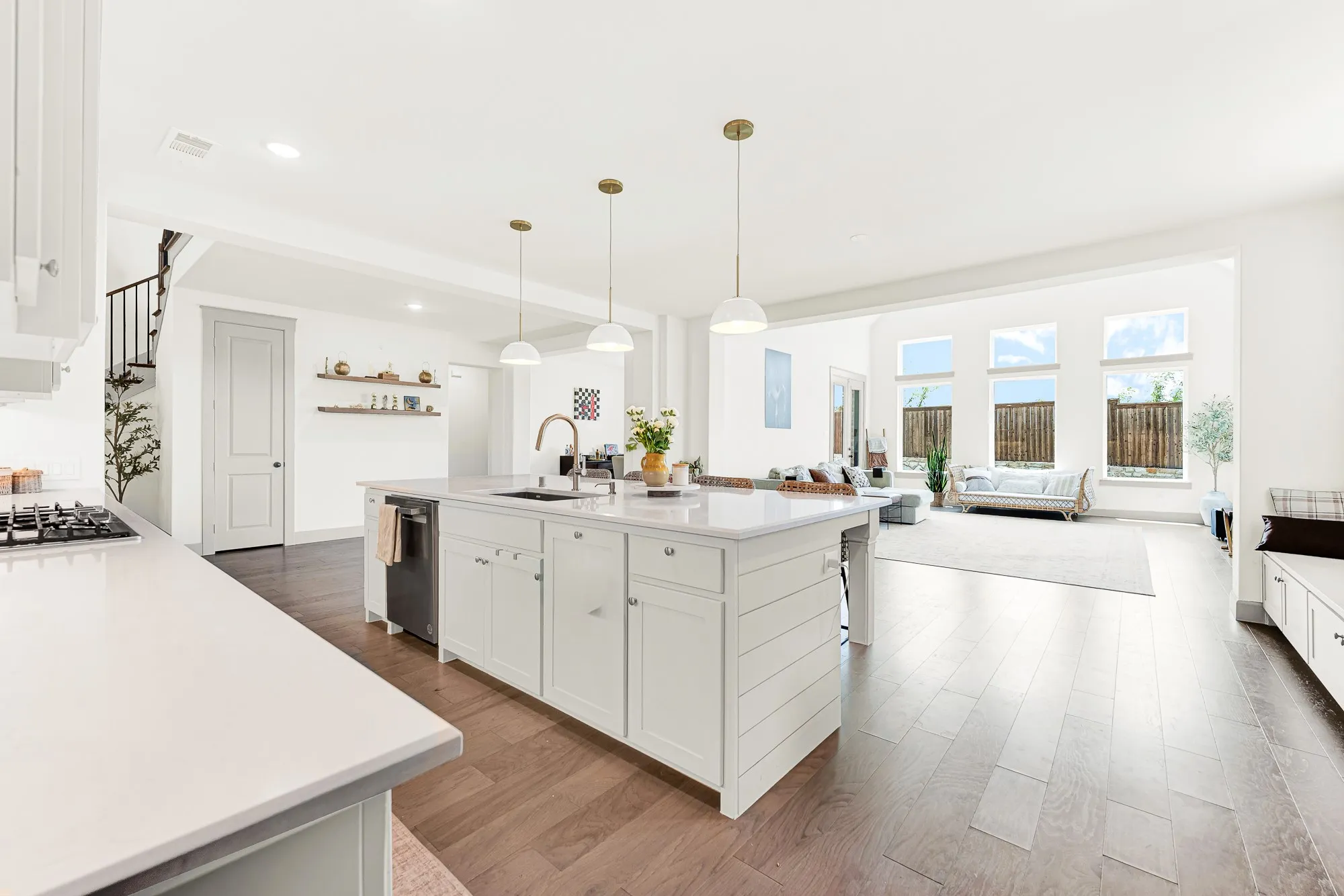 Expansive open-concept layout connects the main cooking hub seamlessly to light-filled adjacent spaces. Perfect for hosting big holiday parties without missing any conversation.