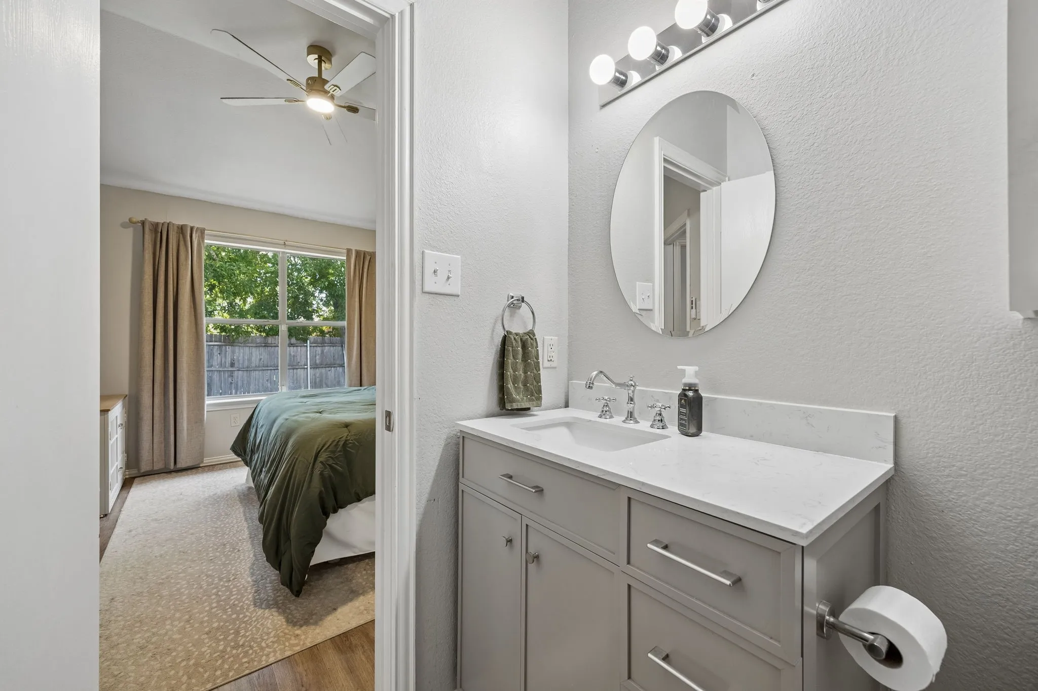 Bathroom vanity with a white countertop and undermount sink