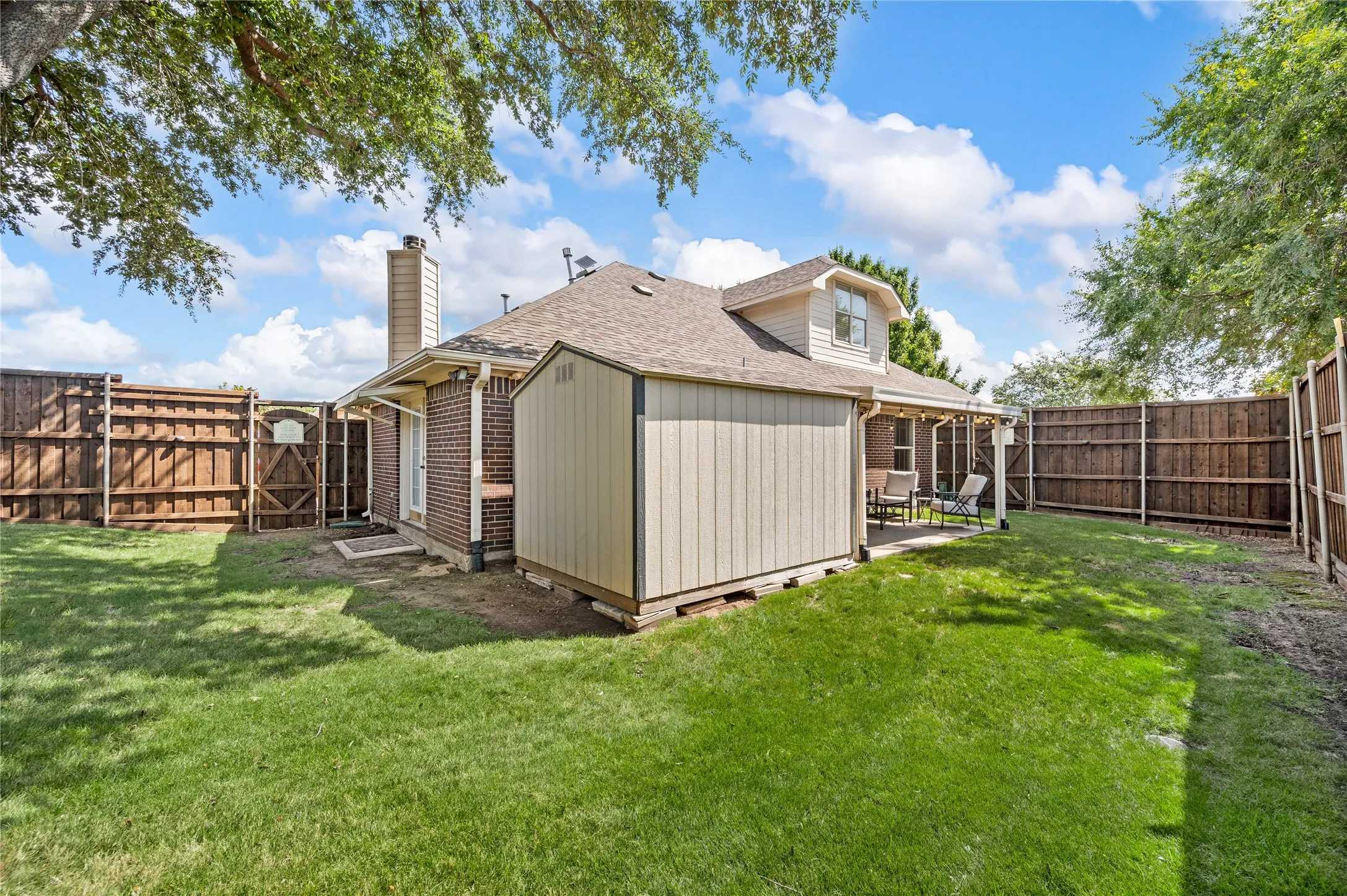 Backyard with large storage shed