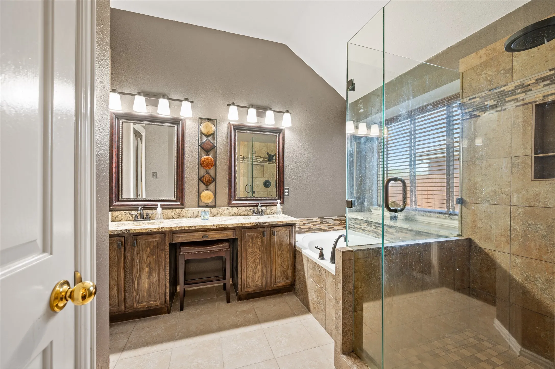 Updated Primary Bathroom with granite, double sinks, jetted tub, and large walk-in shower.