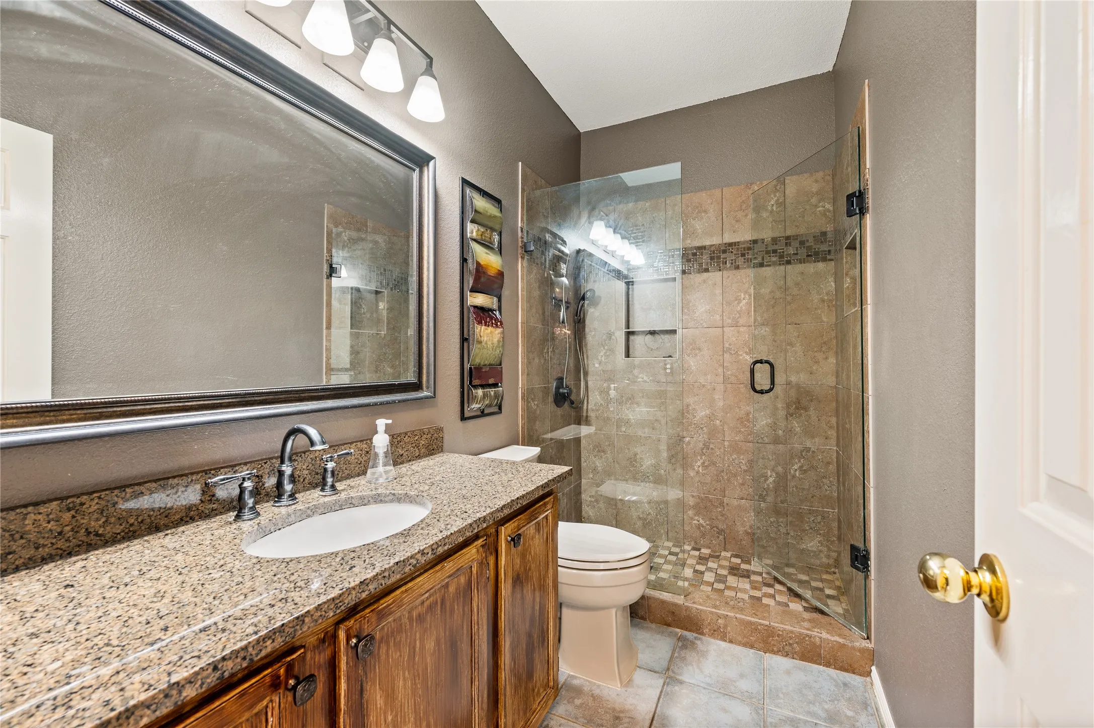 Updated secondary bathroom with oversized walk-in shower