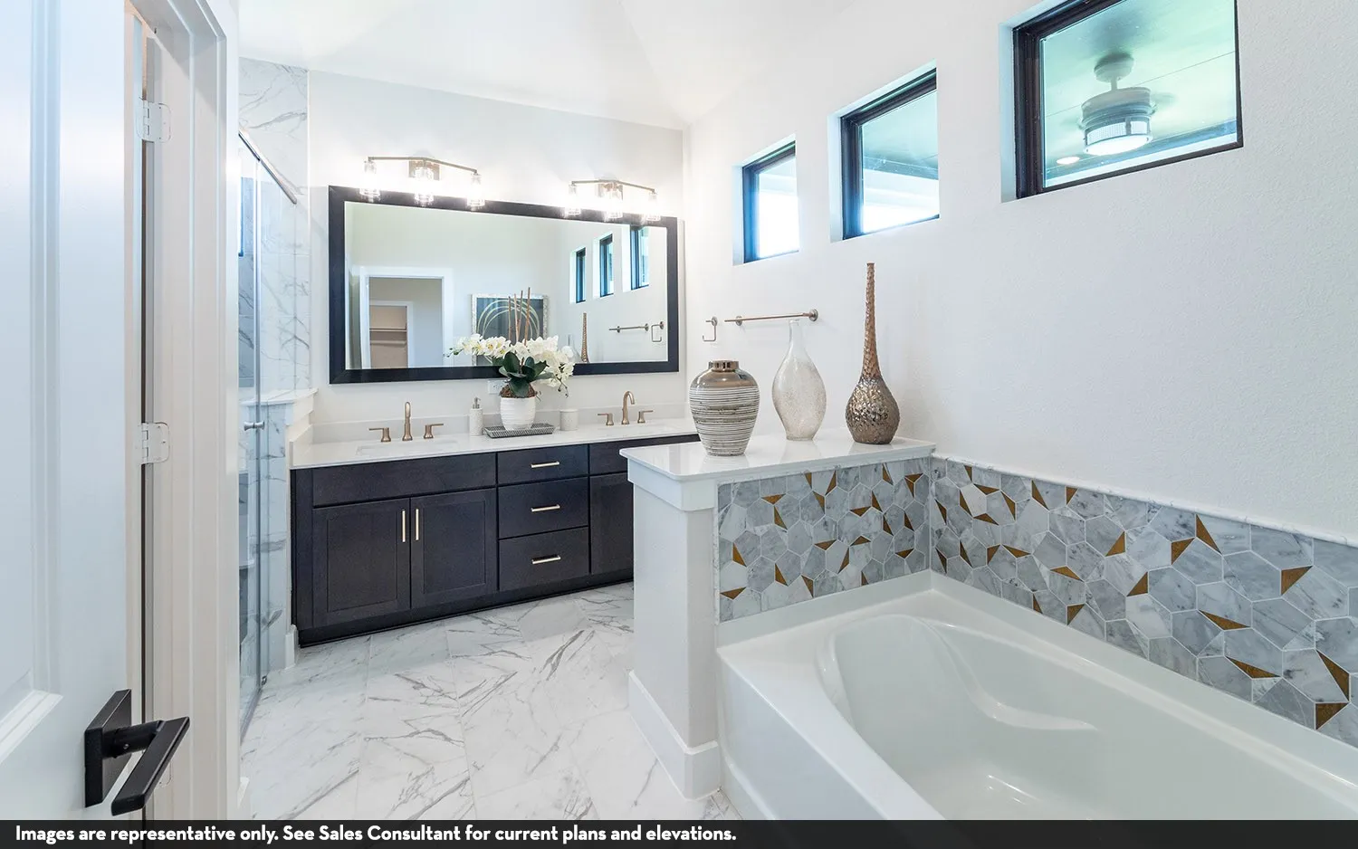 Dual vanity with dark wood-finish cabinetry, white countertops, and a large framed mirror