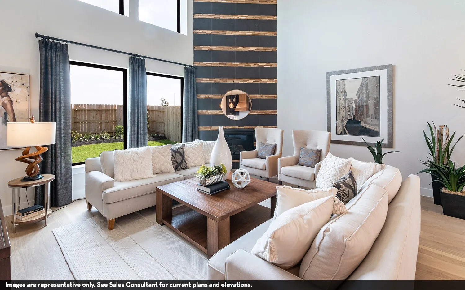 High ceilings, large windows, wood-finish flooring, fireplace with decorative surround, and backyard with fenced perimeter