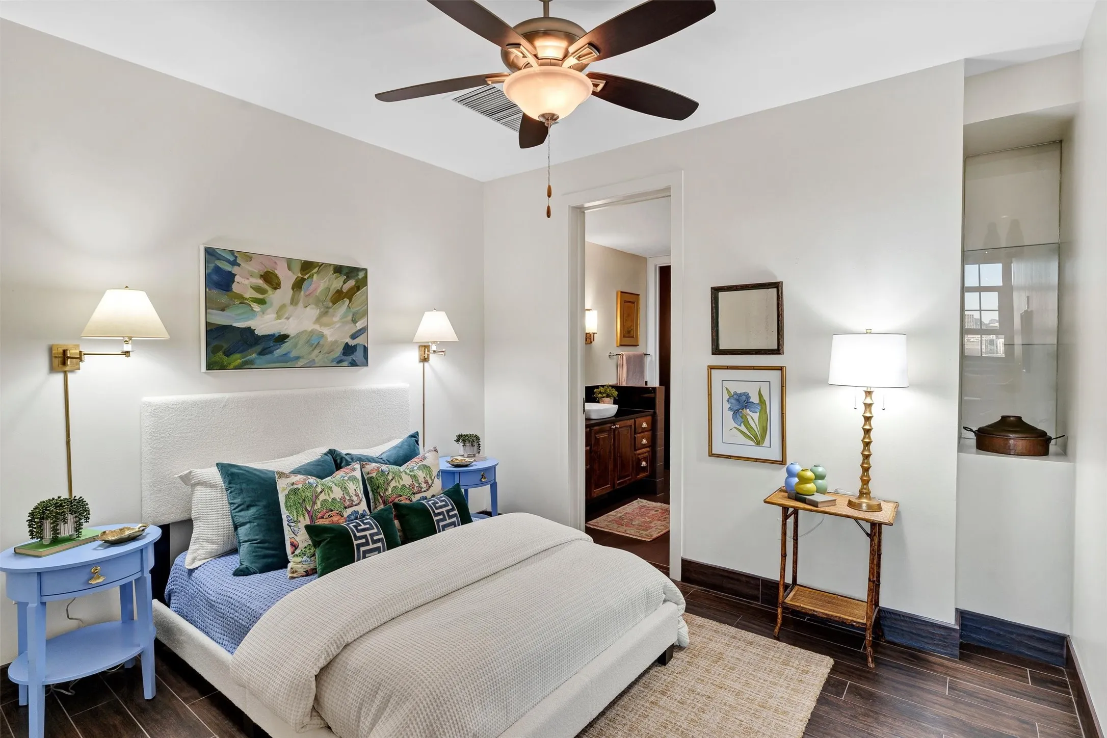 En-suite layout offering complete privacy for guests or family, with built-in wall-sconce wiring that frees up nightstand surface space.