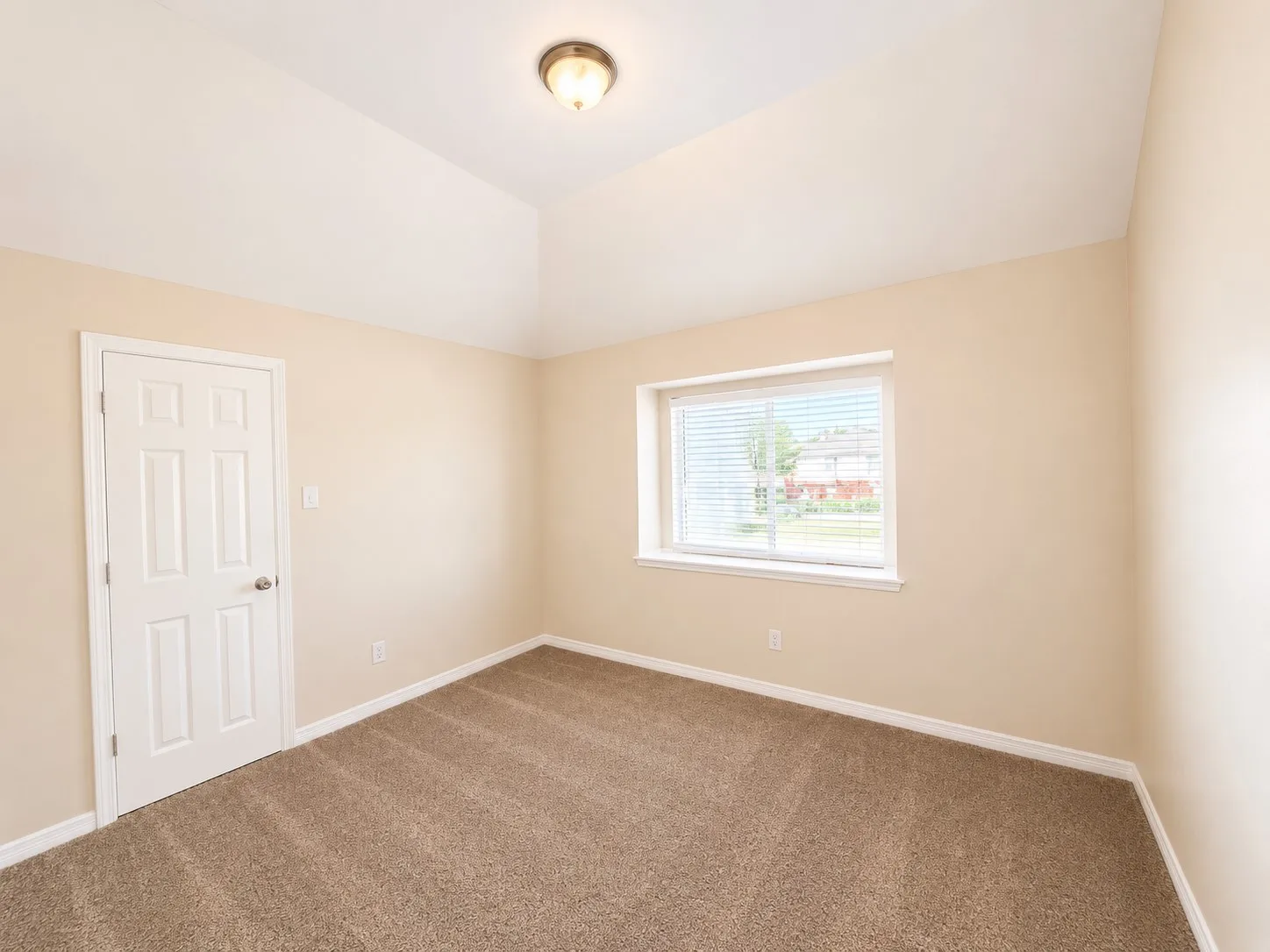 Vaulted ceiling with flush mount lighting