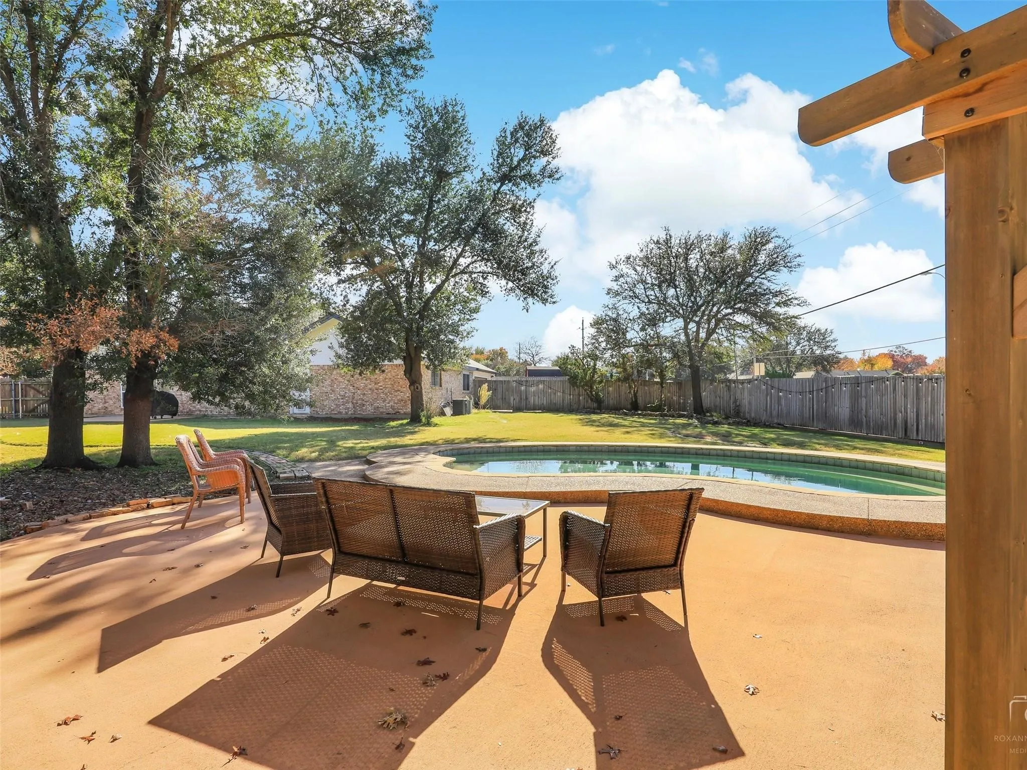 View of terrace with a fenced in pool