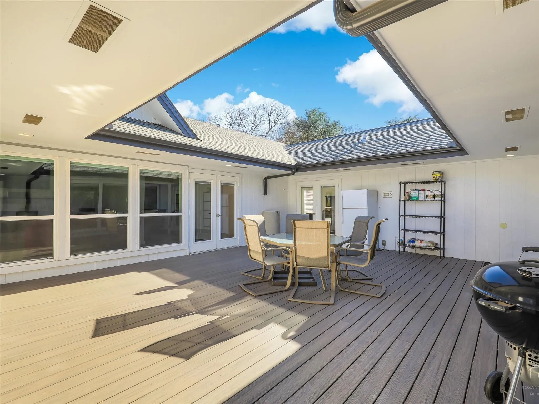 Wooden deck featuring french doors