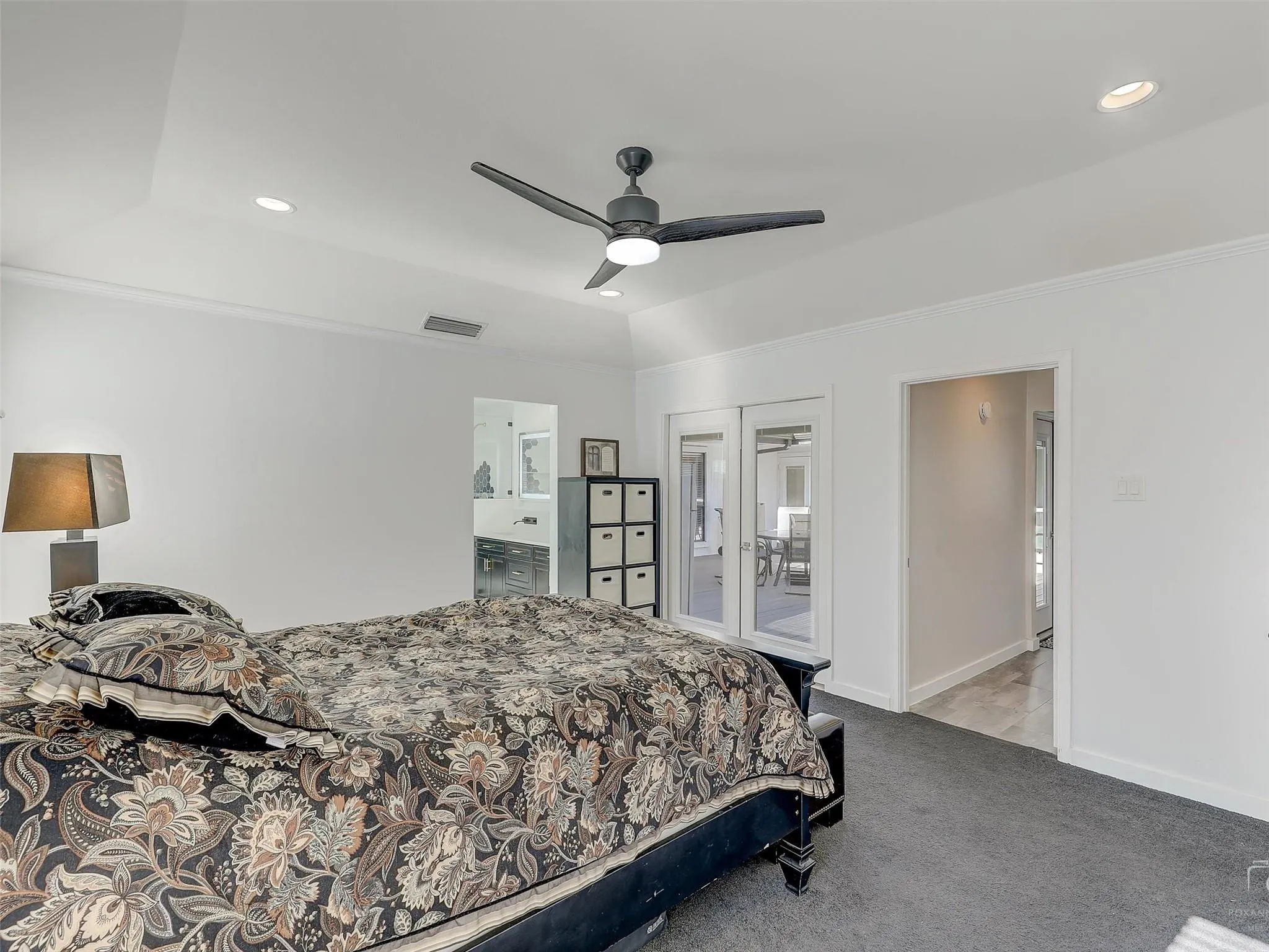 Bedroom with french doors, access to exterior, ceiling fan, and carpet floors