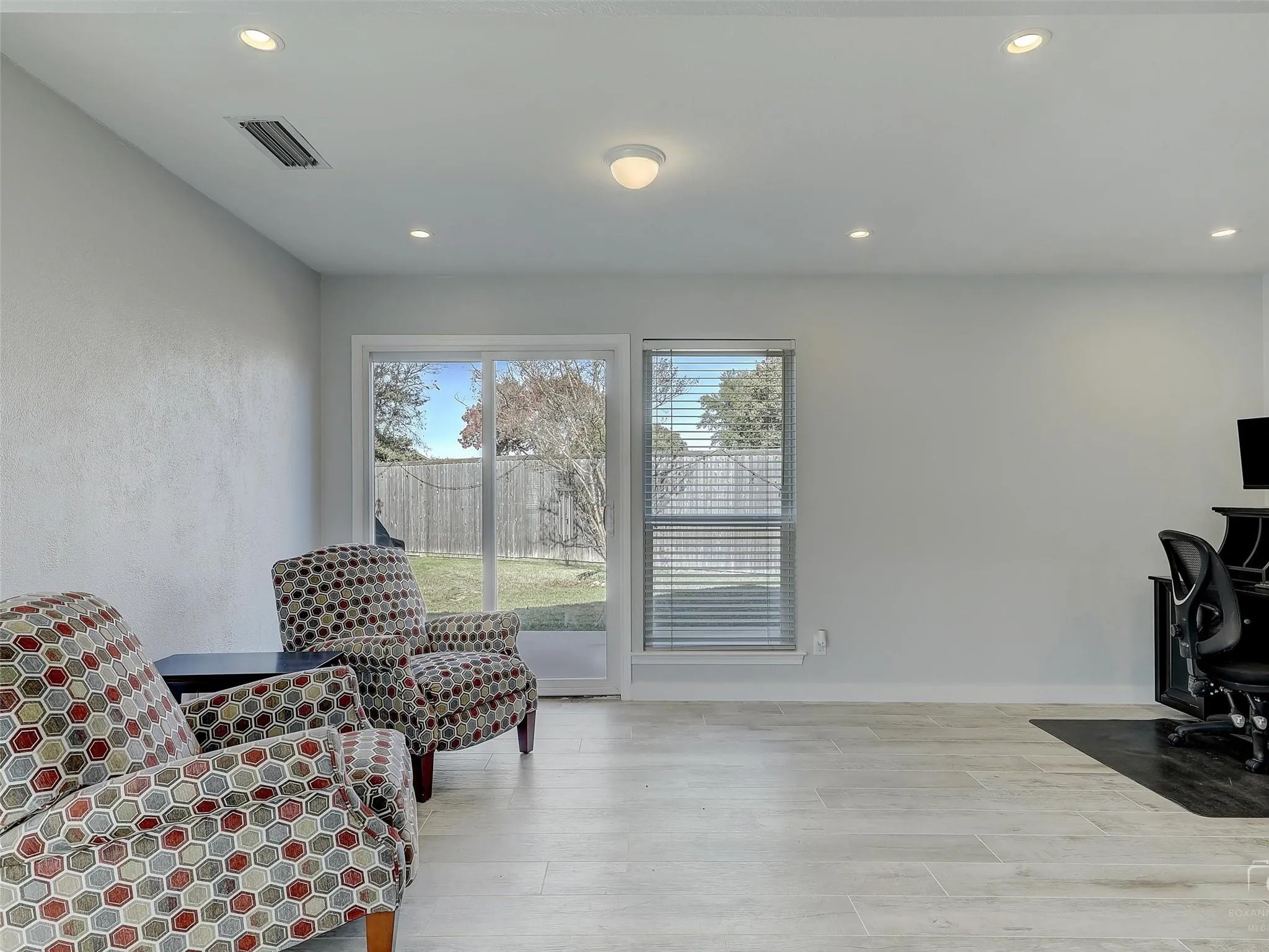 Sitting room featuring light hardwood / wood-style flooring