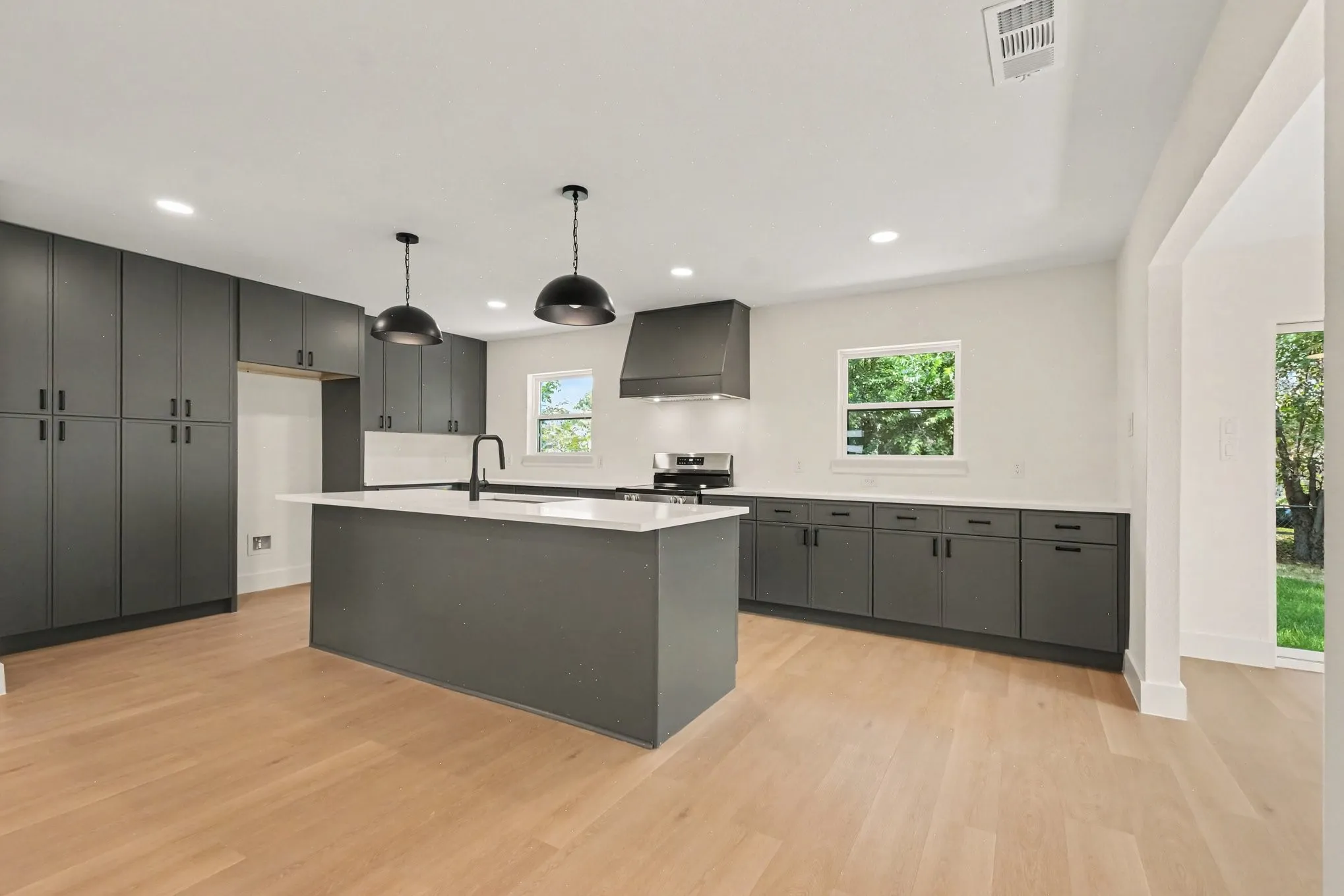 Brand new kitchen complete with island and lots of cabinet and storage space!