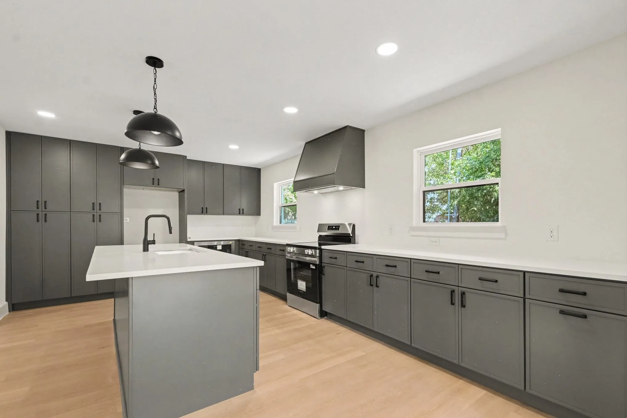 Brand new kitchen complete with island and lots of cabinet and storage space!