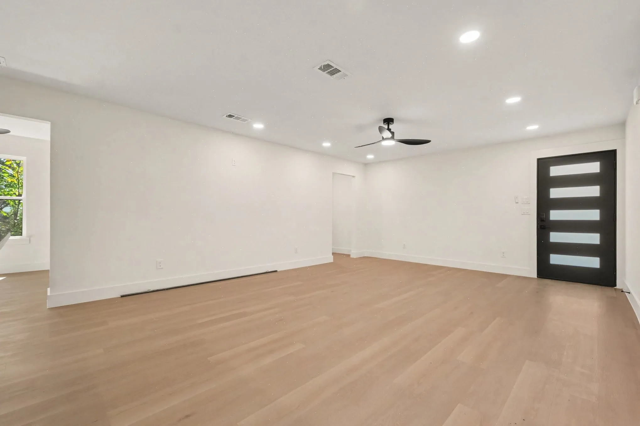 Open living area, recessed lighting throughout.