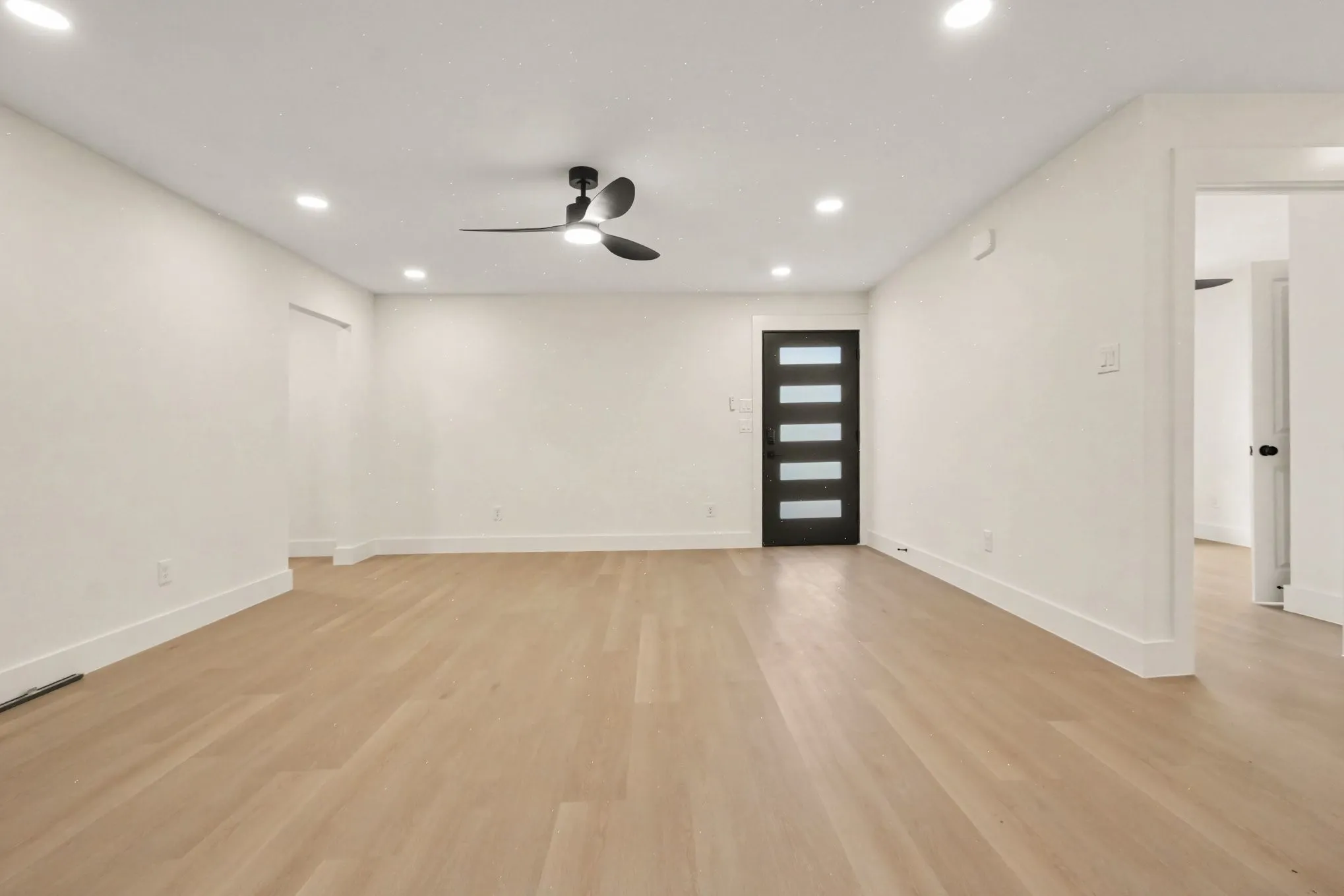 Open living area, recessed lighting throughout.