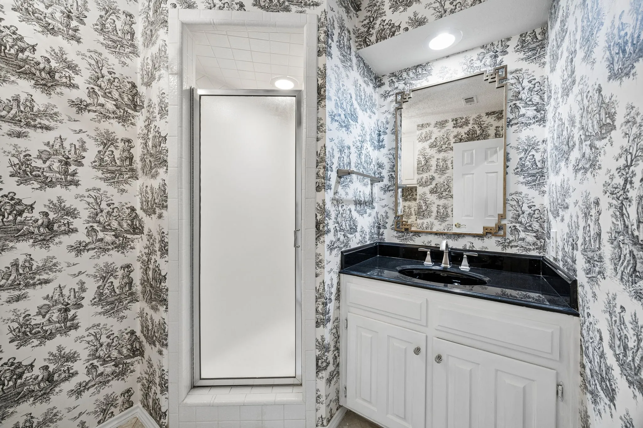 The third bath is split from the others and features a shower.