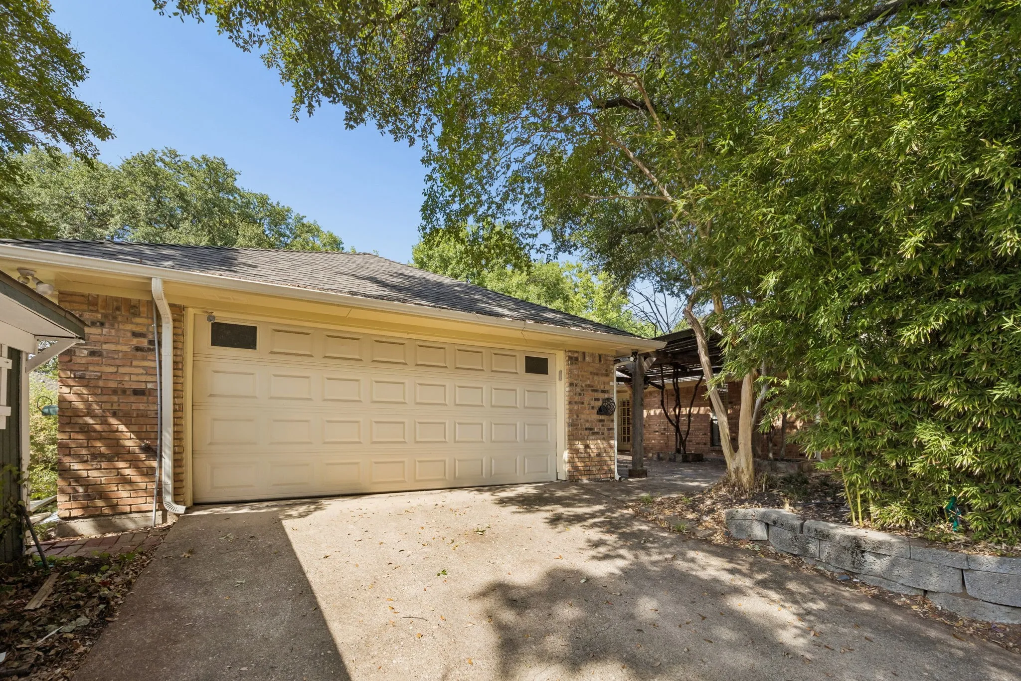 The rear entry garage has open access to the back yard with a security gate at the alley.