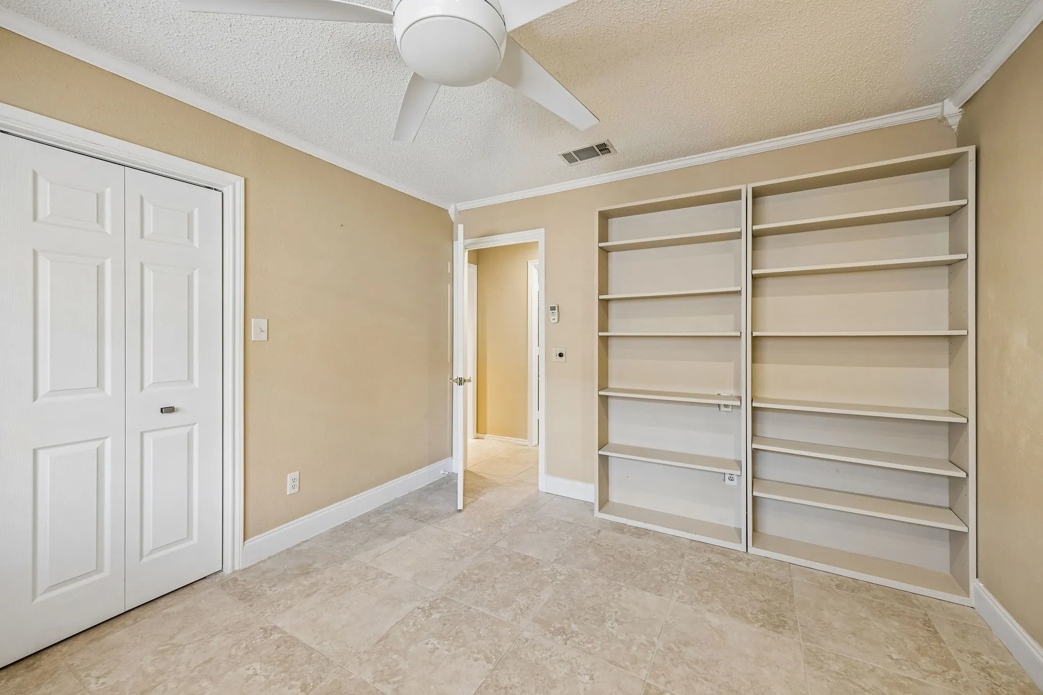 The fourth bedroom with a bathroom across the hall.