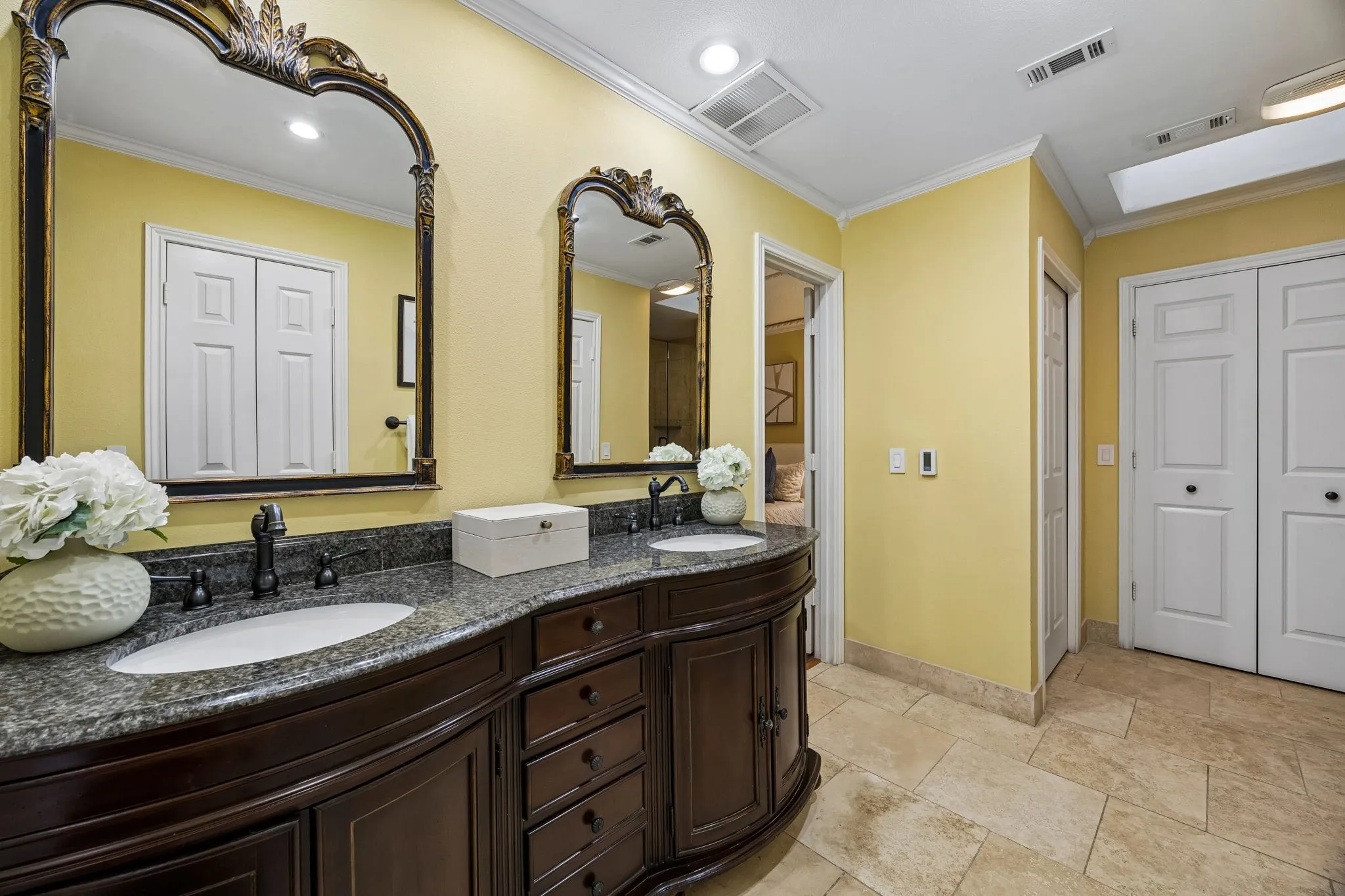 The primary bathroom features a double vanity with storage and the real bonus is the heated floors!