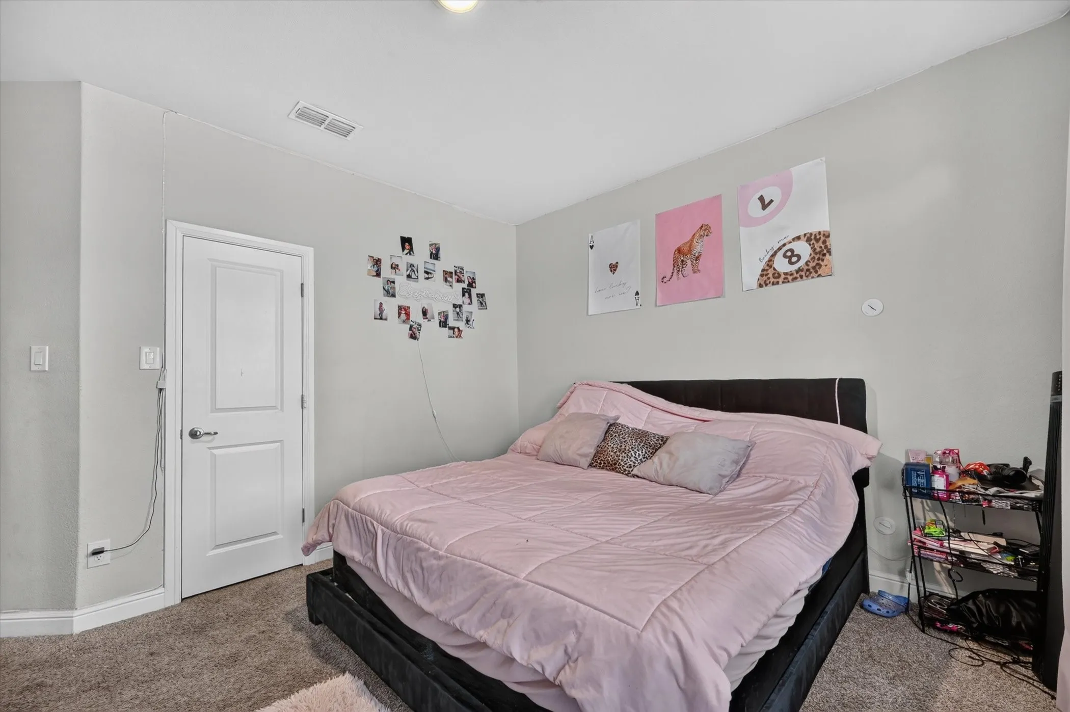 Carpeted flooring, light gray wall paint, and white trim