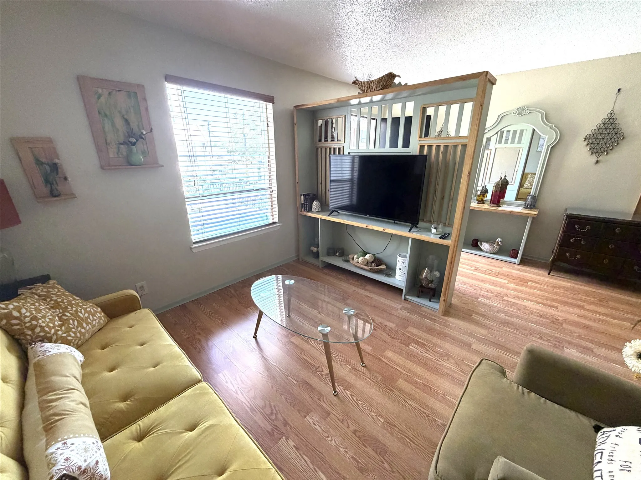 Wood-finish flooring throughout the living space