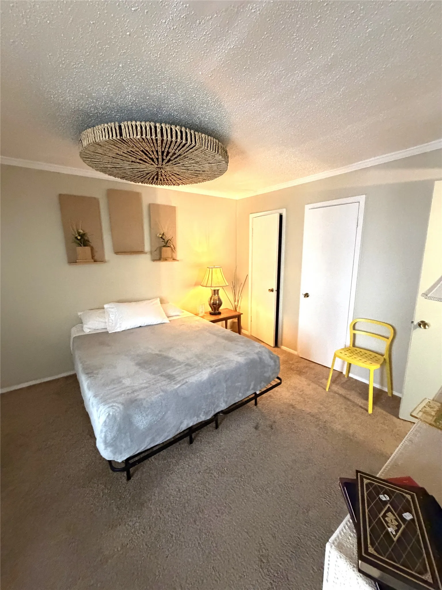 Textured ceiling with a central decorative light fixture