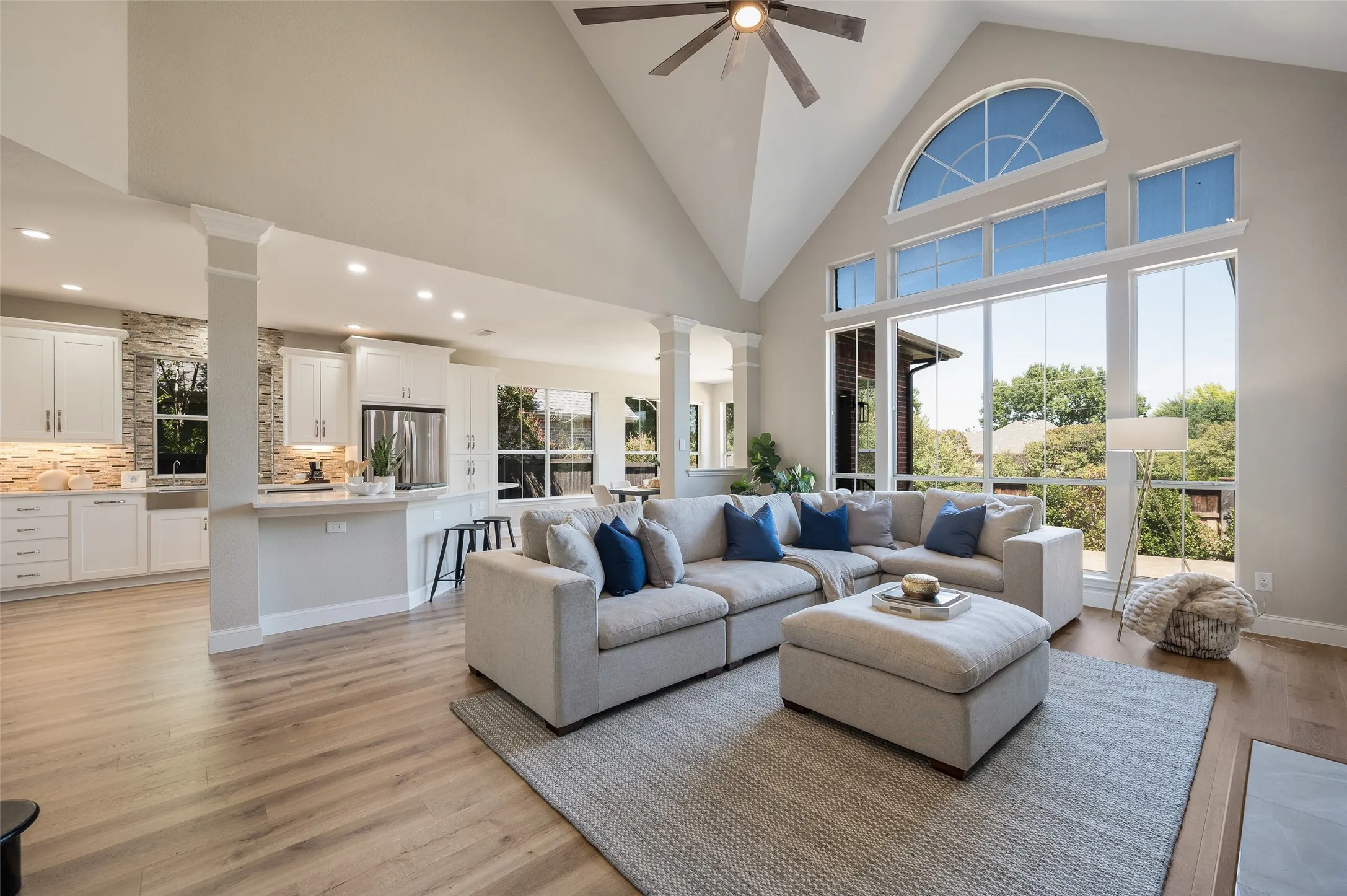 So much beautiful natural light from the wall of windows looking out to the lush backyard.