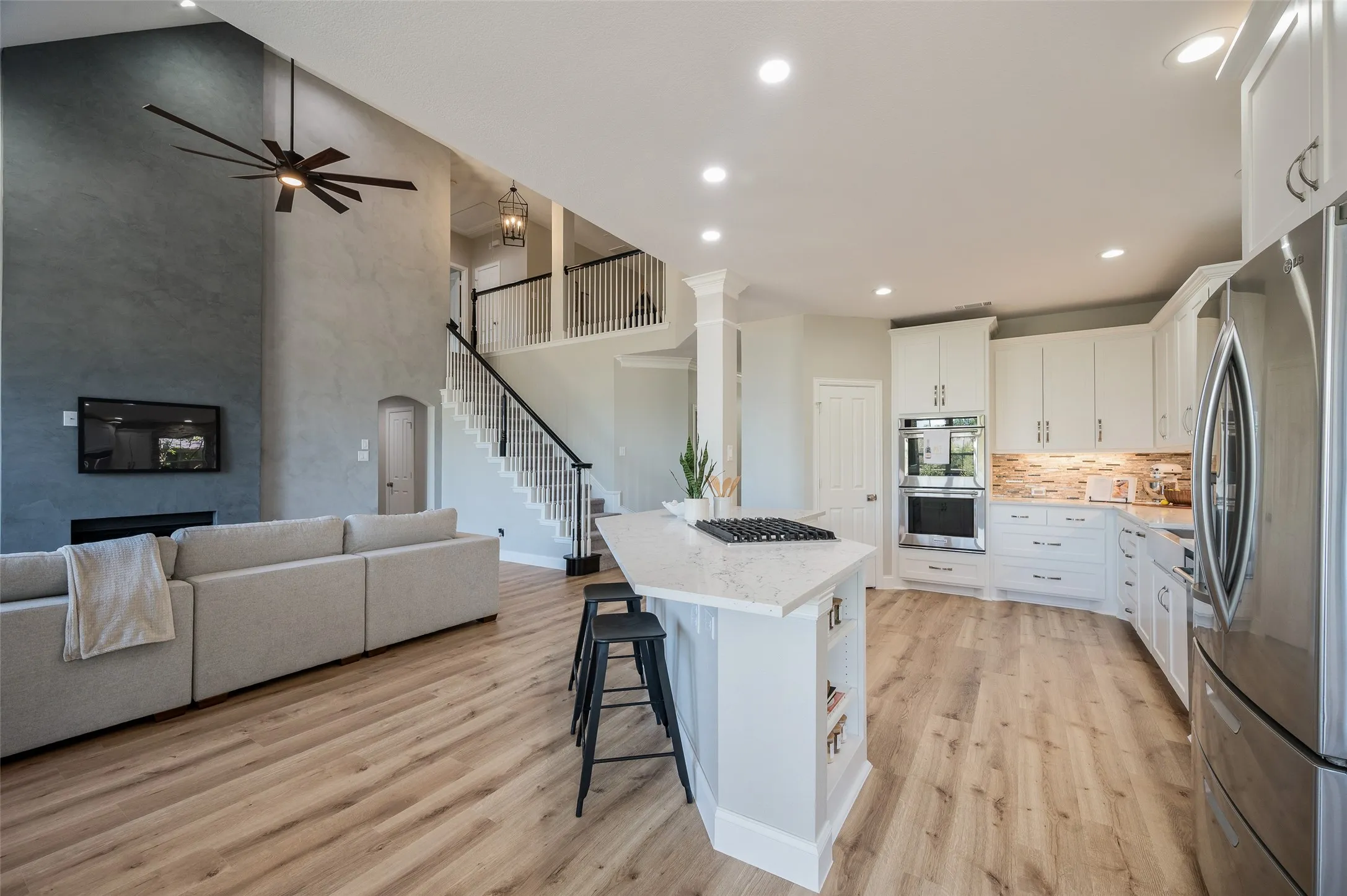 Kitchen is open to the living room and has extra island counter seating.