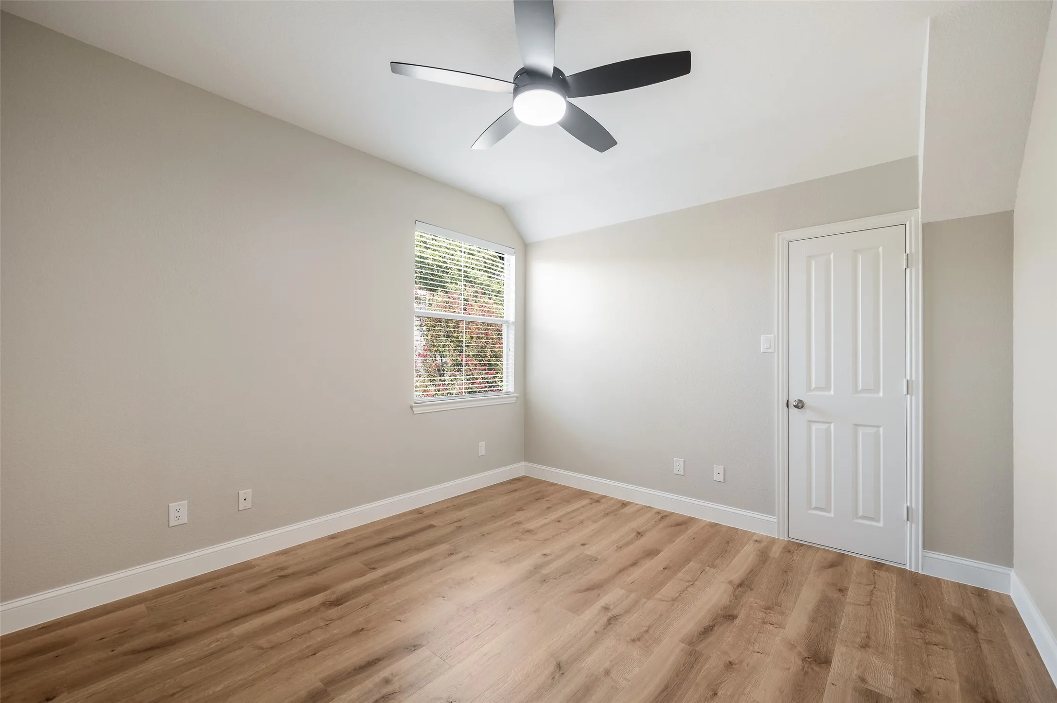 Freshly painted 4th bedroom with updated fan has walk in attic access.