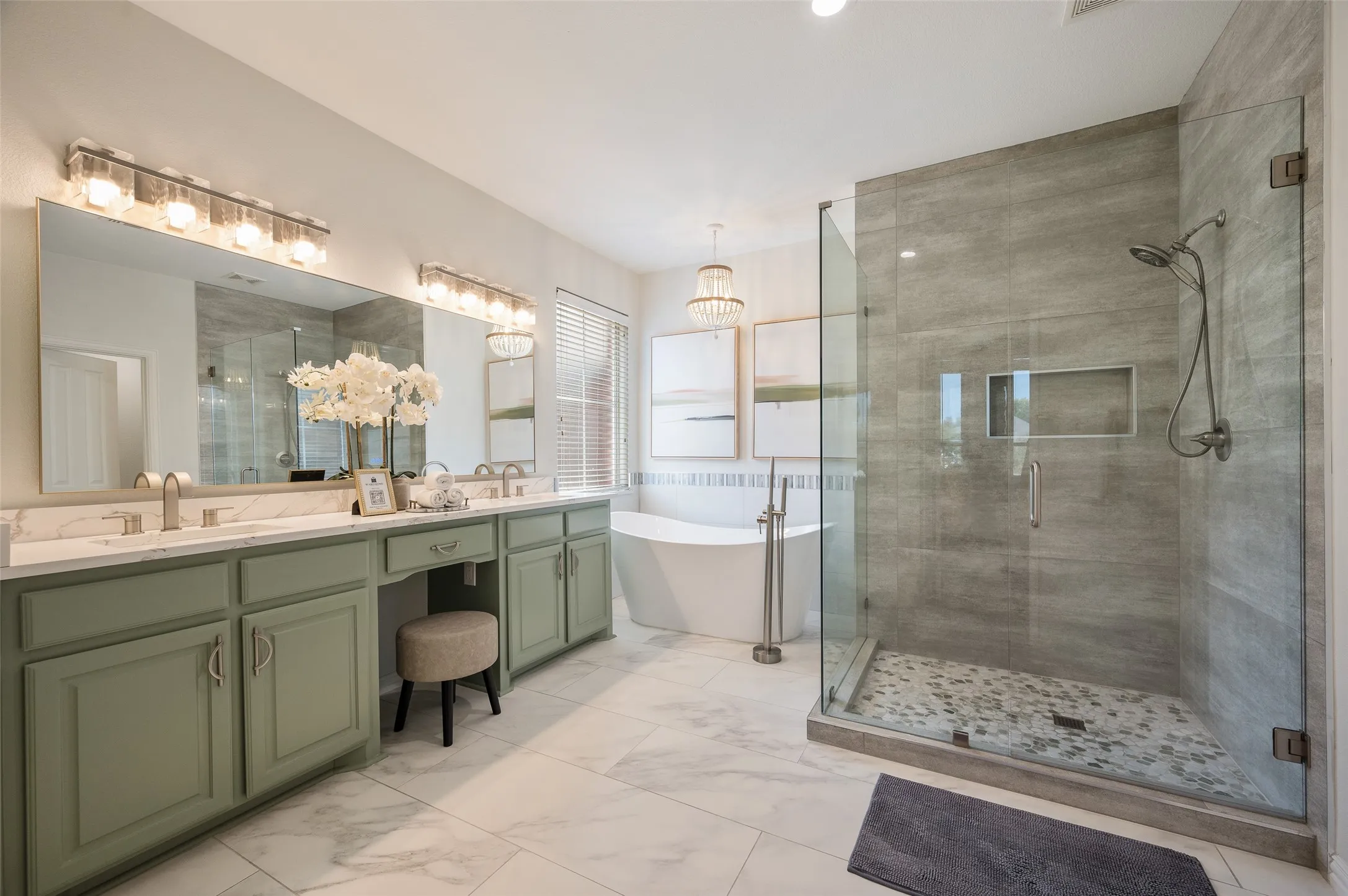 Gorgeous updated primary bathroom features beautiful freshly painted cabinets, an amazing large shower and stand alone tub.