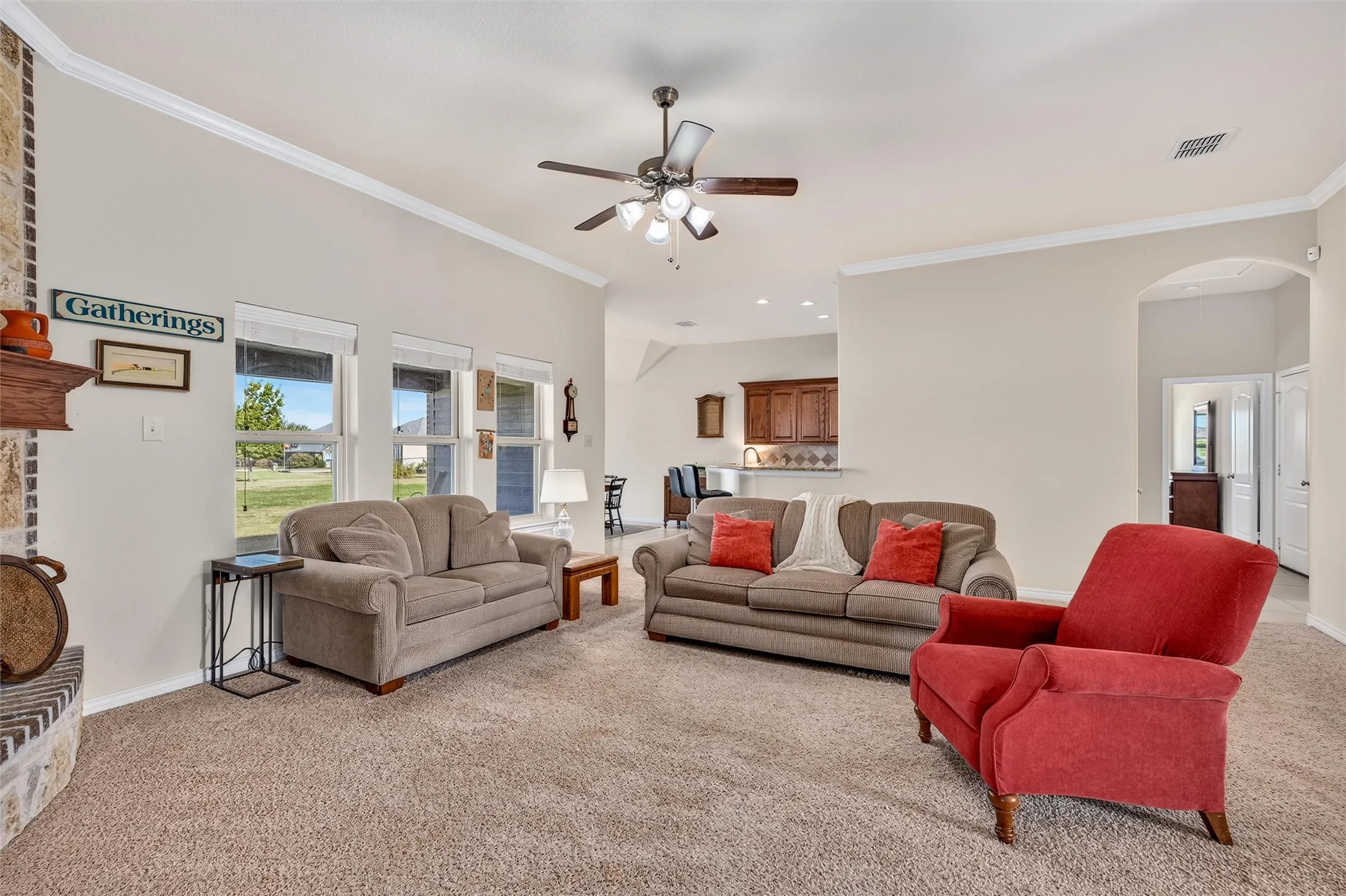 Open floorplan with vaulted ceilings and ceiling fan
