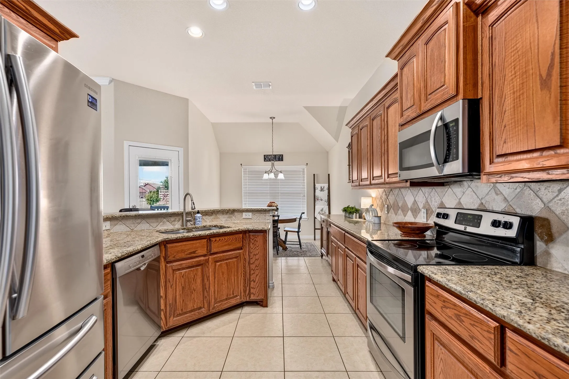 Stainless appliances, electric range, microwave, dishwasher 2018 and garbage disposal 2025