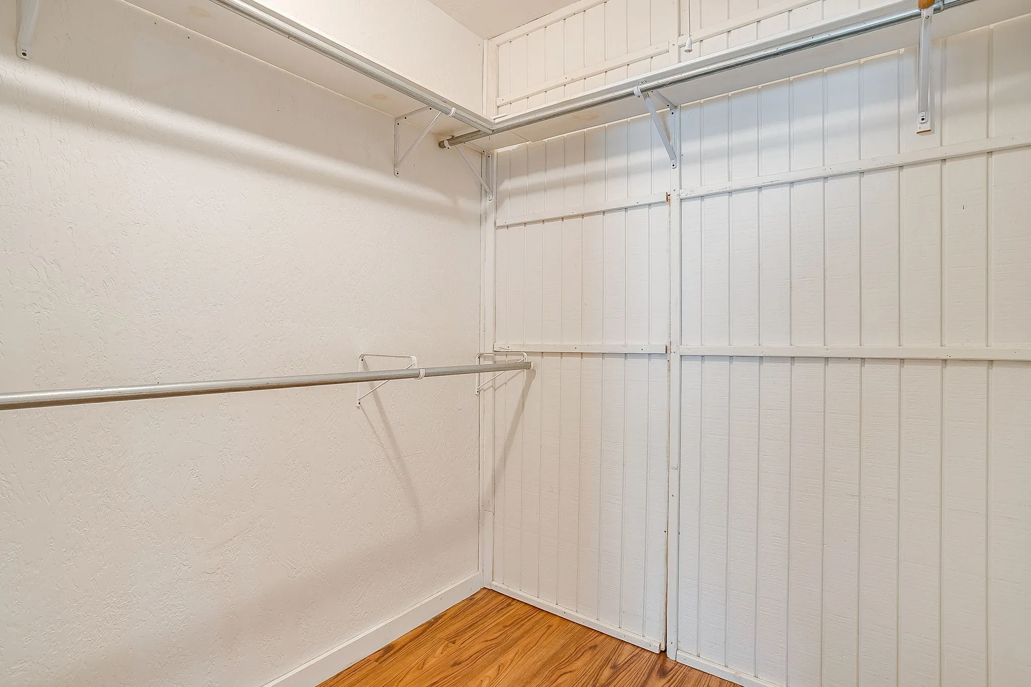 Walk-in closet in primary bedroom
