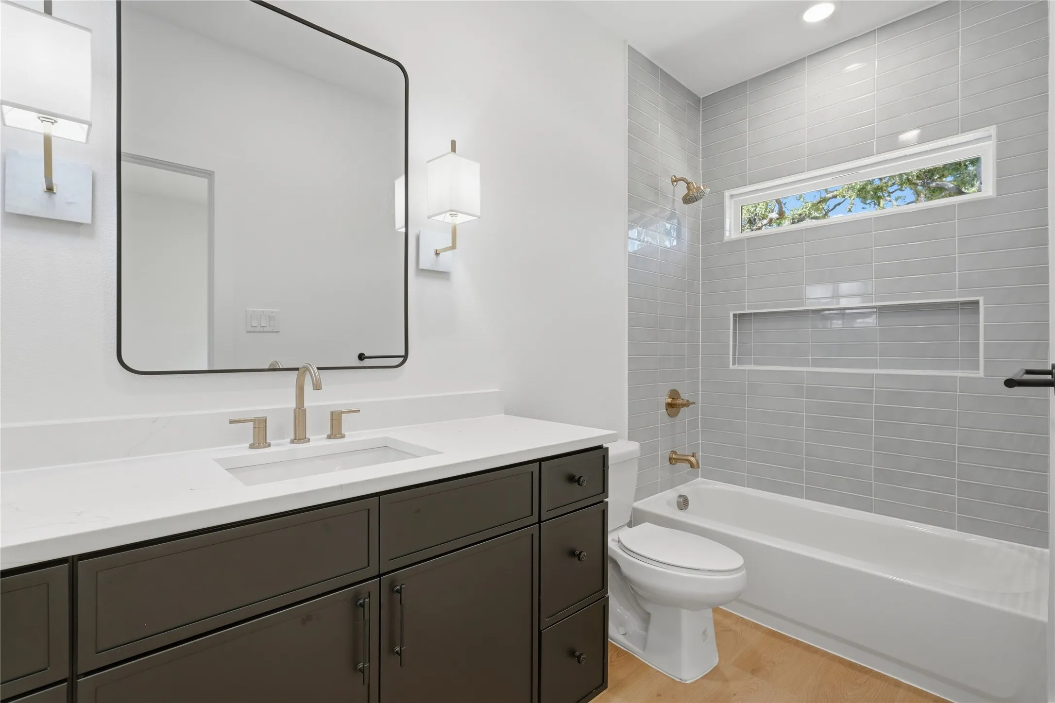Dark wood-finish vanity with a white countertop and rectangular undermount sink