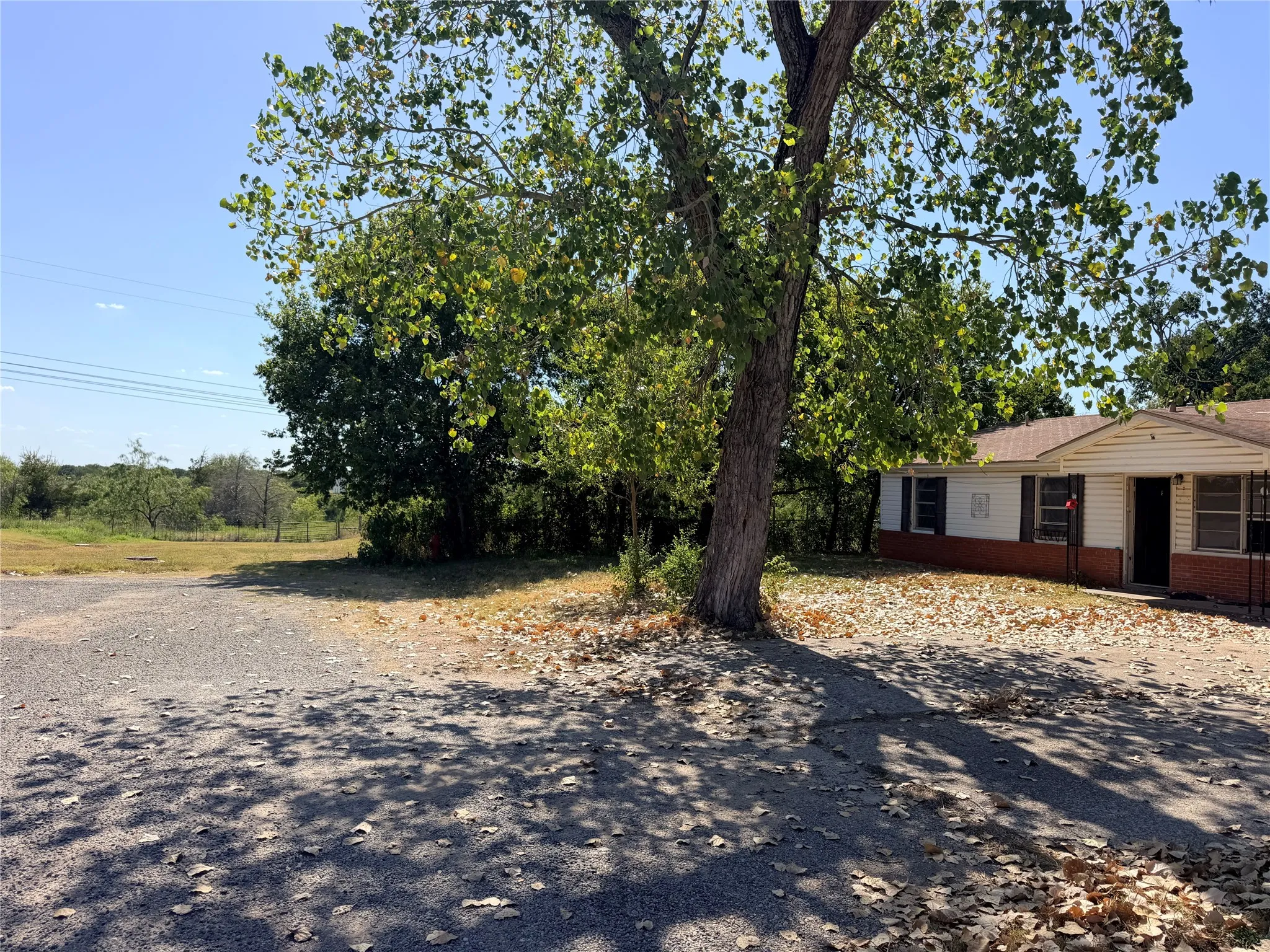 NO Neighbors on the left,
dark trim, and a gabled roofline